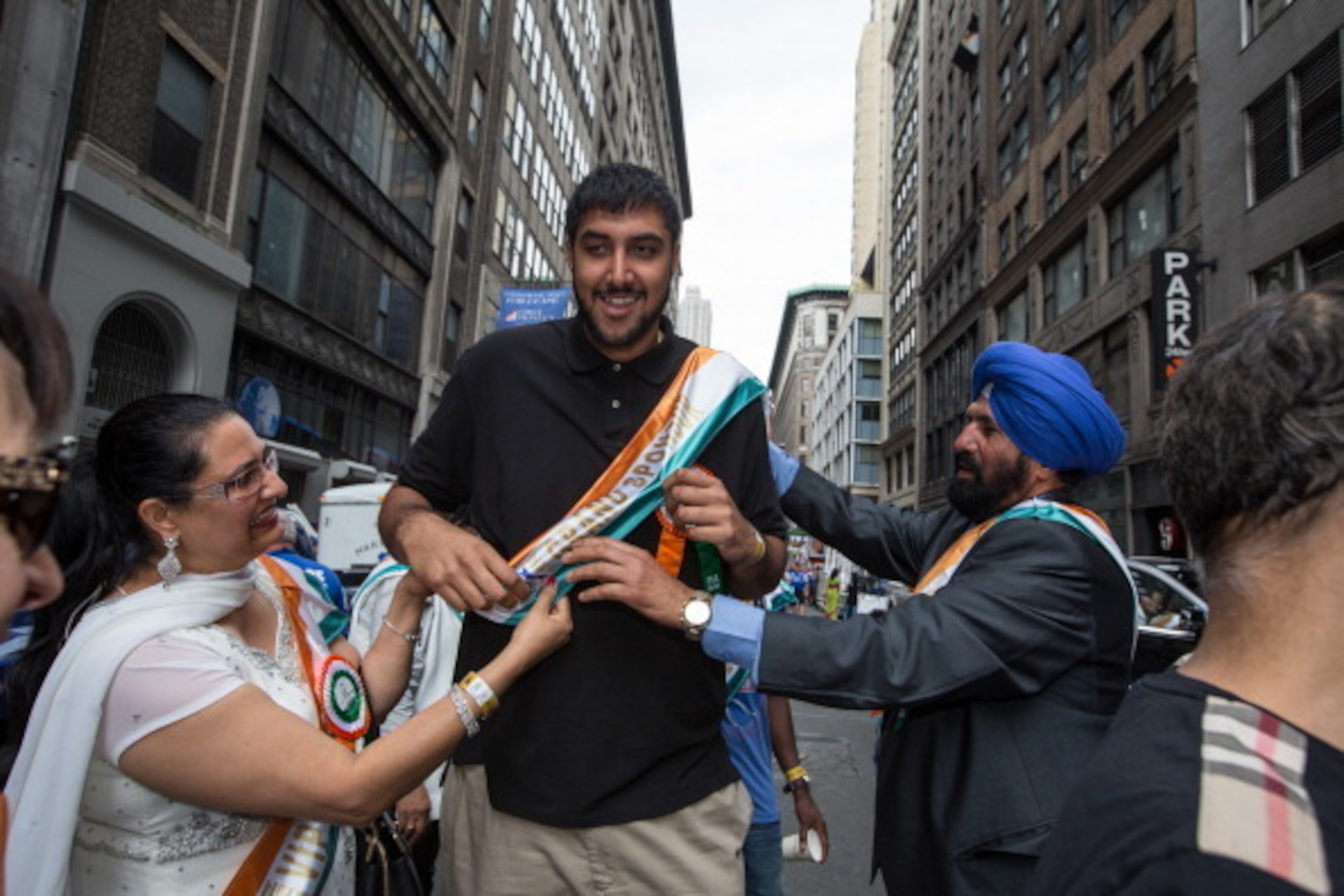 NEW YORK, NY - AUGUST 17: Sim Bhullar of the Sacramento Kings walks during the India Day Parade on August 17, 2014 in New York, New York.  NOTE TO USER: User expressly acknowledges and agrees that, by downloading and or using this photograph, User is cons
