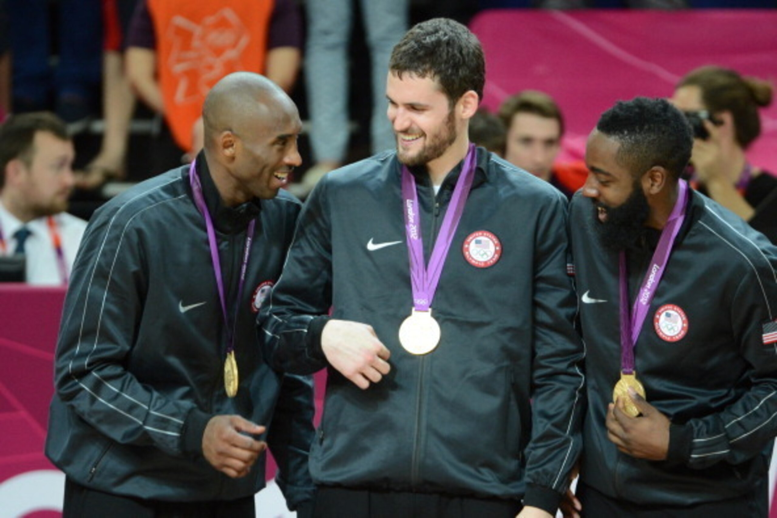 LONDON, ENGLAND - AUGUST 12: Kobe Bryant #10, Kevin Love #11 and James Harden #12 of the US Men's Senior National Team celebrates on the podium with the Gold Medal after their Men's Gold Medal Basketball Game against Spain on Day 16 of the London 2012 Oly LONDON, ENGLAND - AUGUST 12: Kobe Bryant #10, Kevin Love #11 and James Harden #12 of the US Men's Senior National Team celebrates on the podium with the Gold Medal after their Men's Gold Medal Basketball Game against Spain on Day 16 of the London 2012 Oly