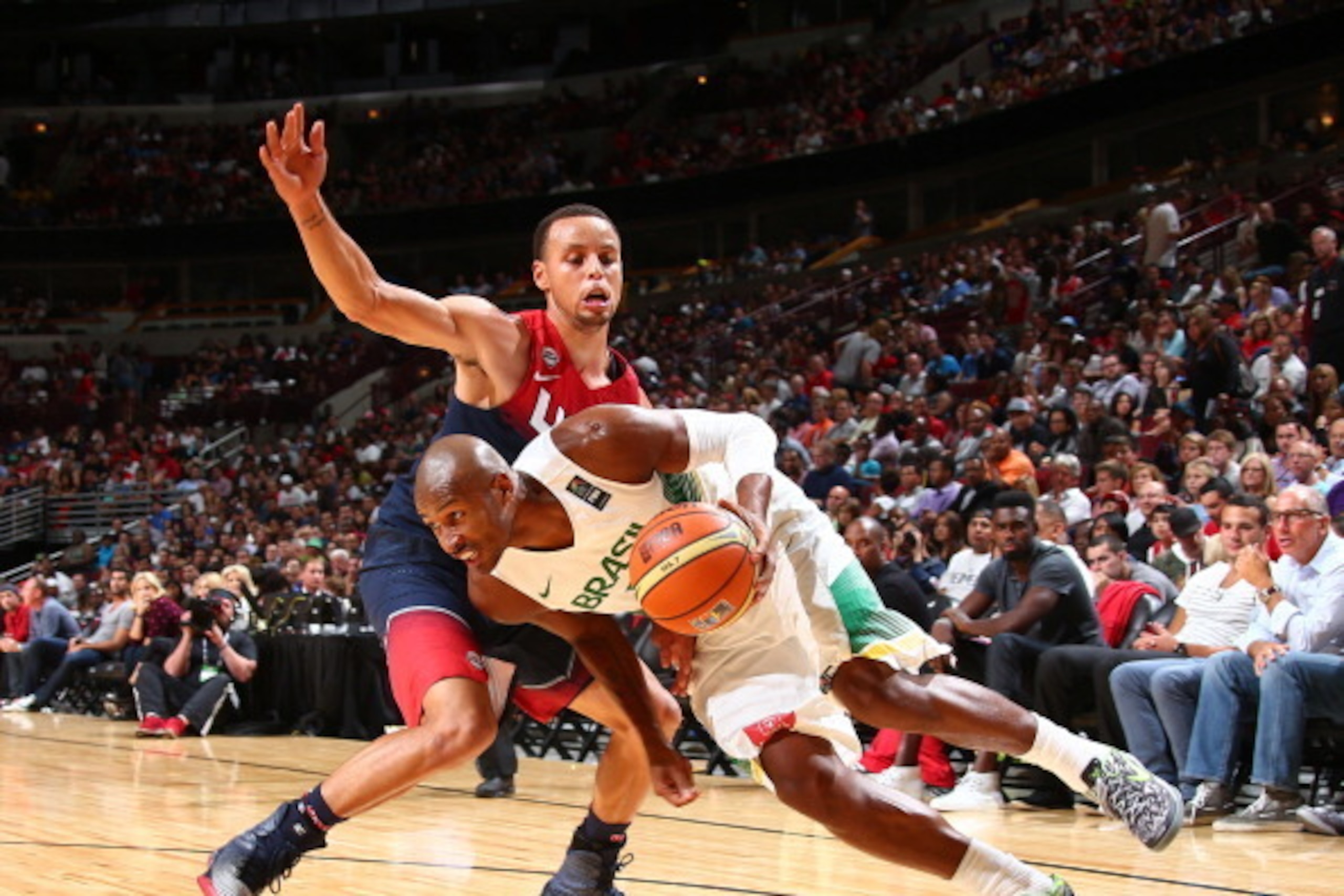 CHICAGO, IL - AUGUST 16: Leandro Barbosa #10 of the Brazil Basketball Men's National Team drives against Stephen Curry #4 of the USA Basketball Men's National Team on August 16, 2014 at the United Center in Chicago, Illinois.  NOTE TO USER: User expressly