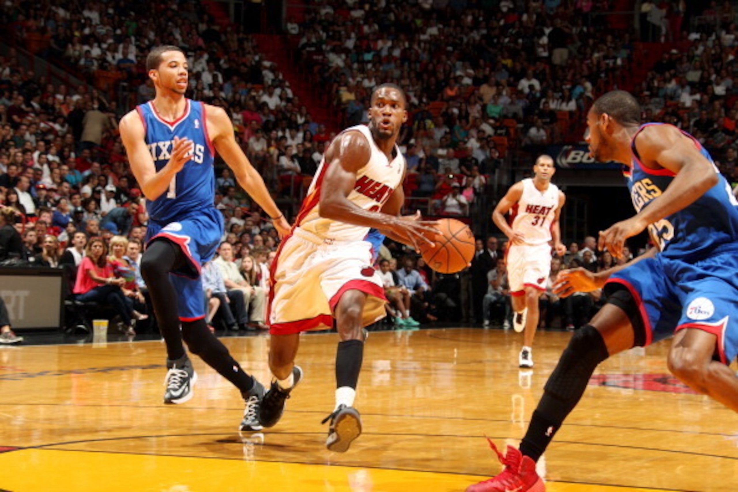 MIAMI, FL - April 16: Toney Douglas #0 of the Miami Heat drives against the Philadelphia 76ers at the American Airlines Arena in Miami, Florida on April 16, 2014. NOTE TO USER: User expressly acknowledges and agrees that, by downloading and/or using this 