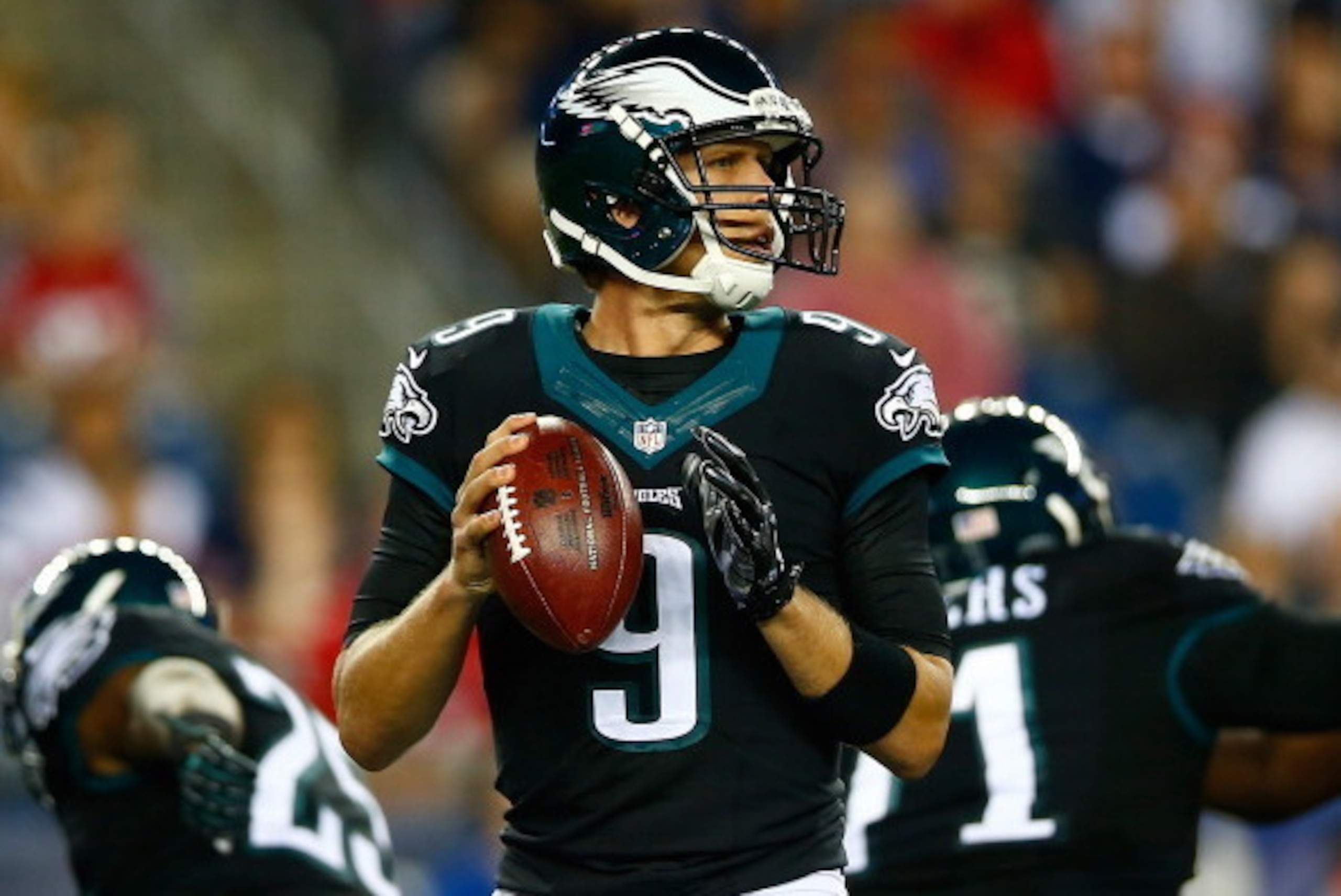 FOXBORO, MA - AUGUST 15: Nick Foles #9 of the Philadelphia Eagles drops back to pass against the New England Patriots during the preseason game at Gillette Stadium on August 15, 2014 in Foxboro, Massachusetts.  (Photo by Jared Wickerham/Getty Images)