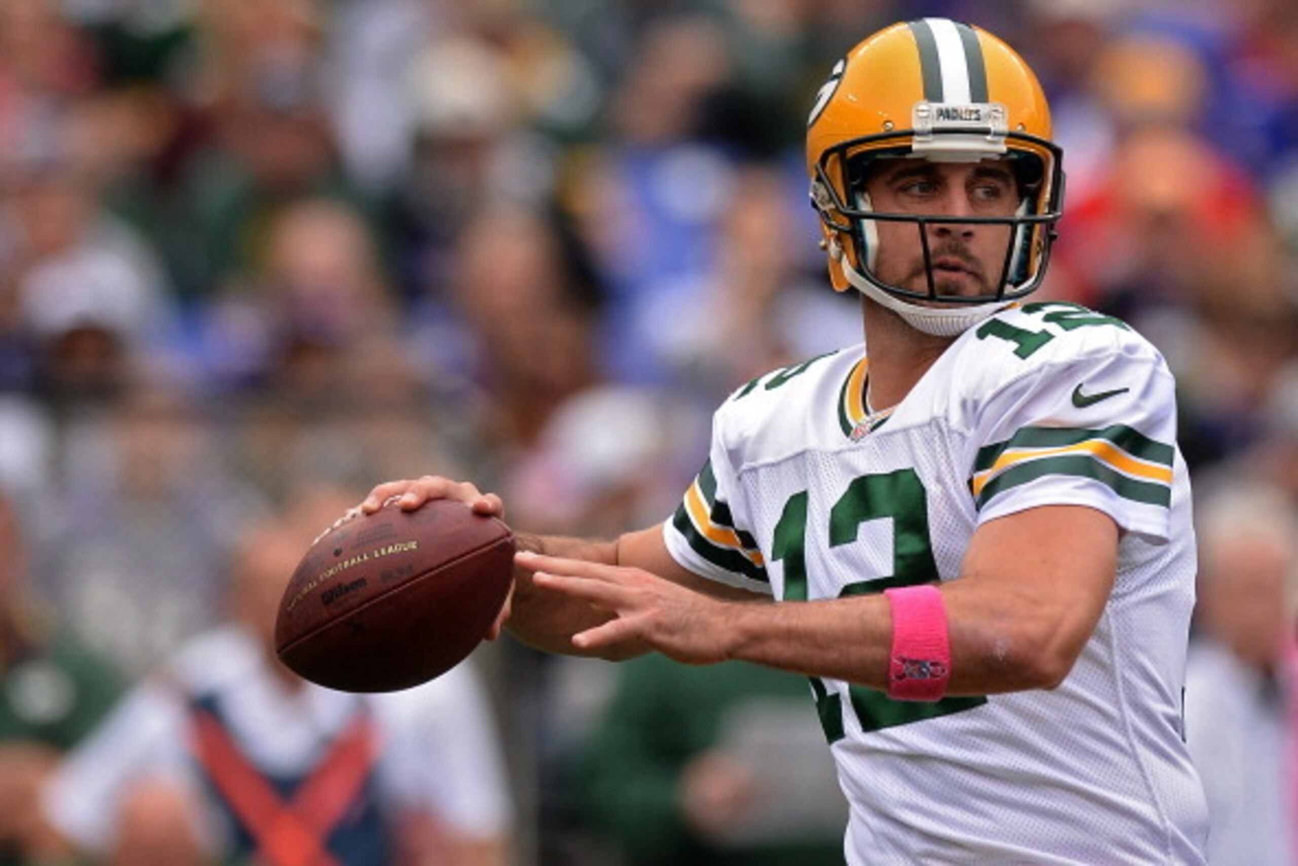 BALTIMORE, MD - OCTOBER 13: Quarterback Aaron Rodgers #12 of the Green Bay Packers passes against the Baltimore Ravens in the first quarter at M&T Bank Stadium on October 13, 2013 in Baltimore, Maryland. (Photo by Patrick Smith/Getty Images)