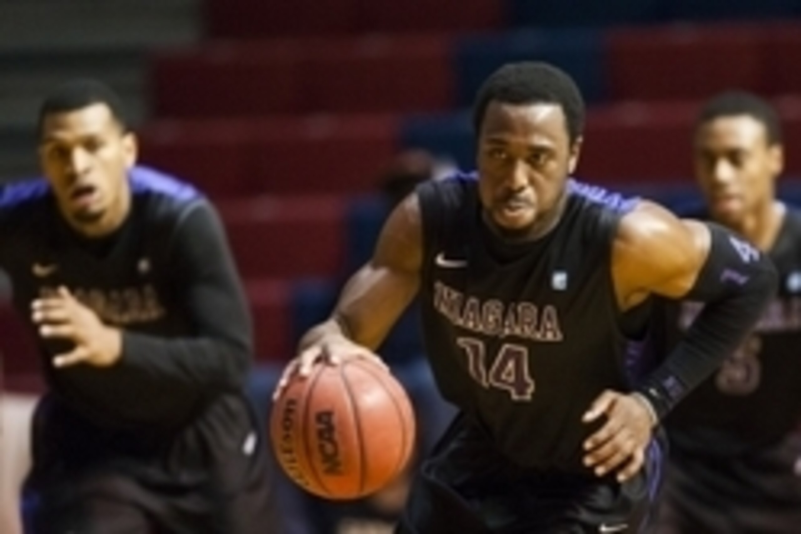 Nov 26, 2013; Philadelphia, PA, USA; Niagara Purple Eagles guard Antoine Mason (14) brings the ball up court during the first half against the Pennsylvania Quakers at the Palestra. Mandatory Credit: Howard Smith-USA TODAY Sports