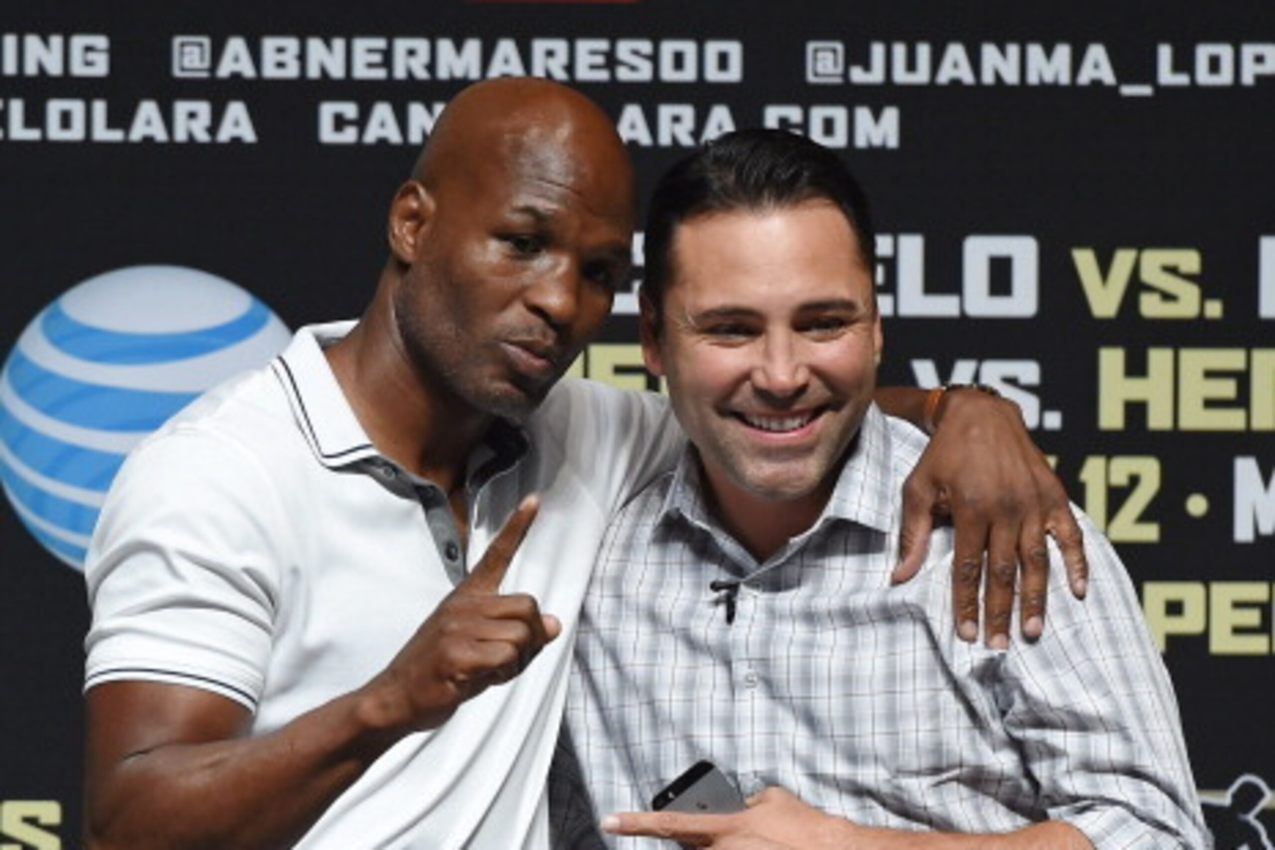 LAS VEGAS, NV - JULY 11:  Boxer Bernard Hopkins (L) and President of Golden Boy Promotions Oscar De La Hoya pose as they are introduced at the official weigh-in for Canelo Alvarez and Erislandy Lara at the MGM Grand Garden Arena on July 11, 2014 in Las Ve