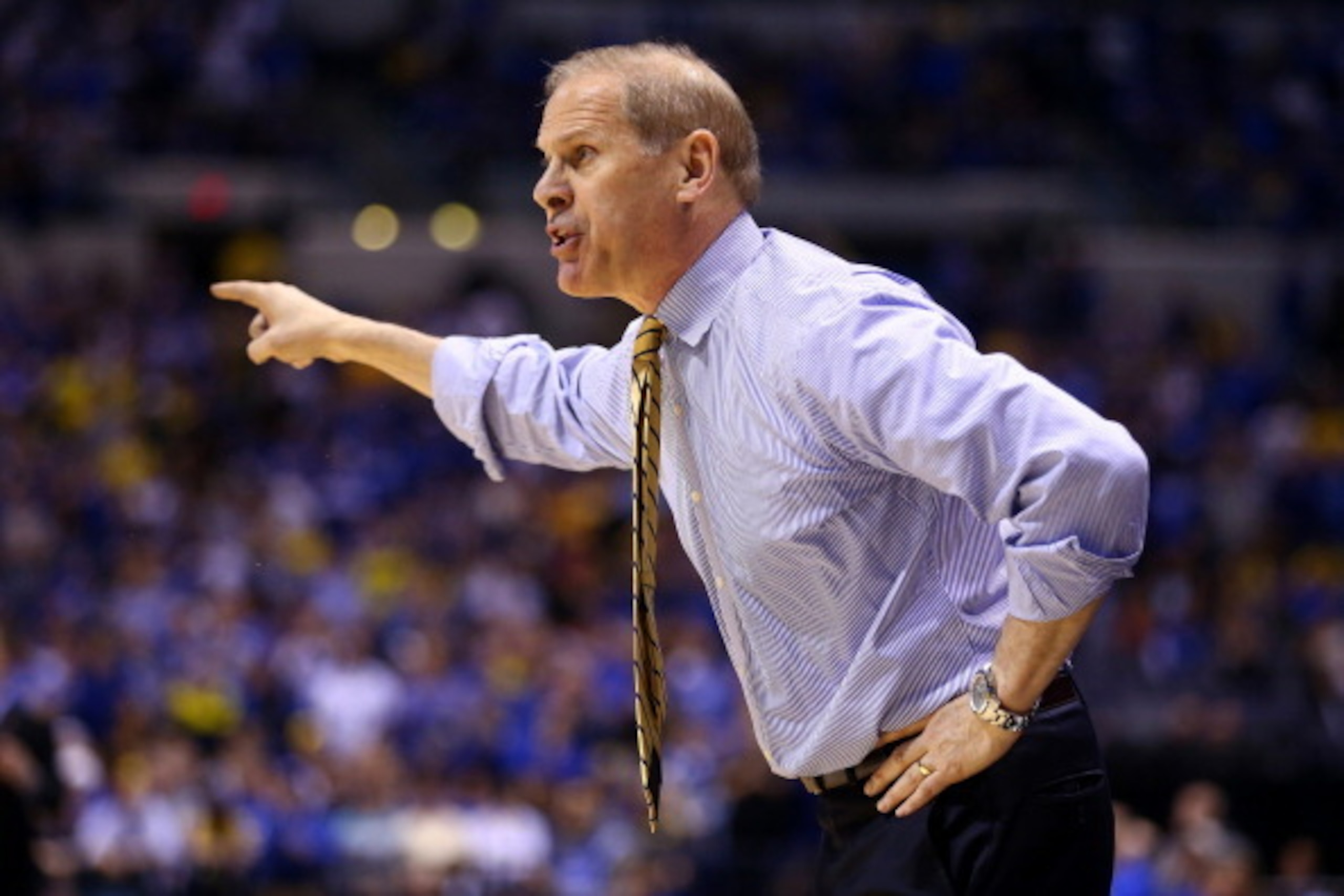 INDIANAPOLIS, IN - MARCH 30: Head coach John Beilein of the Michigan Wolverines shouts to his players against the Kentucky Wildcats during the midwest regional final of the 2014 NCAA Men's Basketball Tournament at Lucas Oil Stadium on March 30, 2014 in I INDIANAPOLIS, IN - MARCH 30: Head coach John Beilein of the Michigan Wolverines shouts to his players against the Kentucky Wildcats during the midwest regional final of the 2014 NCAA Men's Basketball Tournament at Lucas Oil Stadium on March 30, 2014 in I