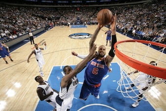 DALLAS, TX - NOVEMBER 21: Tyson Chandler #6 of the New York Knicks goes in for the dunk against Elton Brand #42 of the Dallas Mavericks on November 21, 2012 at the American Airlines Center in Dallas, Texas. NOTE TO USER: User expressly acknowledges and ag