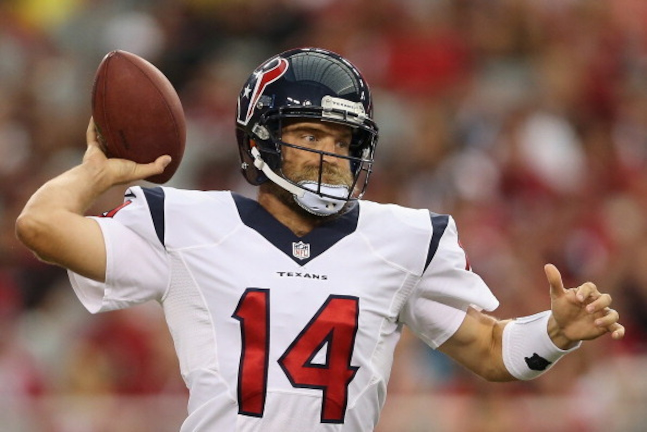 GLENDALE, AZ - AUGUST 09:  Quarterback Ryan Fitzpatrick #14 of the Houston Texans drops back to pass during the preseason NFL game against the Arizona Cardinals at the University of Phoenix Stadium on August 9, 2014 in Glendale, Arizona.  (Photo by Christ