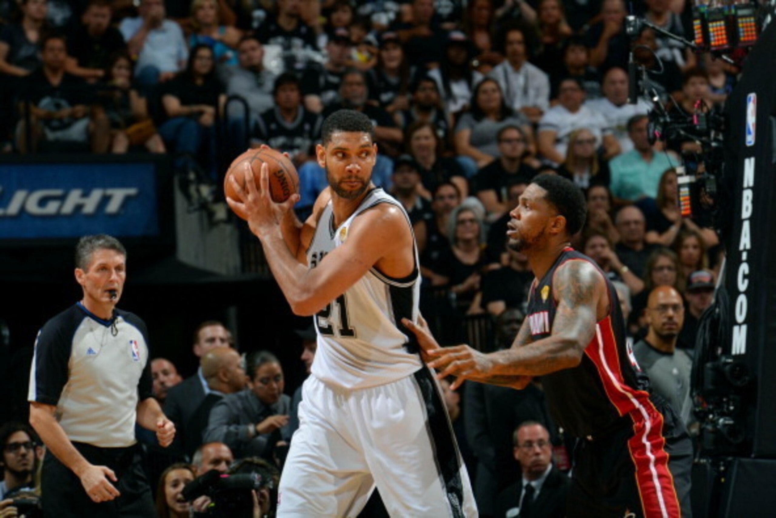 SAN ANTONIO, TX - JUNE 15: Tim Duncan #21 of the San Antonio Spurs handles the ball against Norris Cole #30 of the Miami Heat in Game Five of the 2014 NBA Finals on June 15, 2014 at AT&T Center in San Antonio, Texas. NOTE TO USER: User expressly acknowled