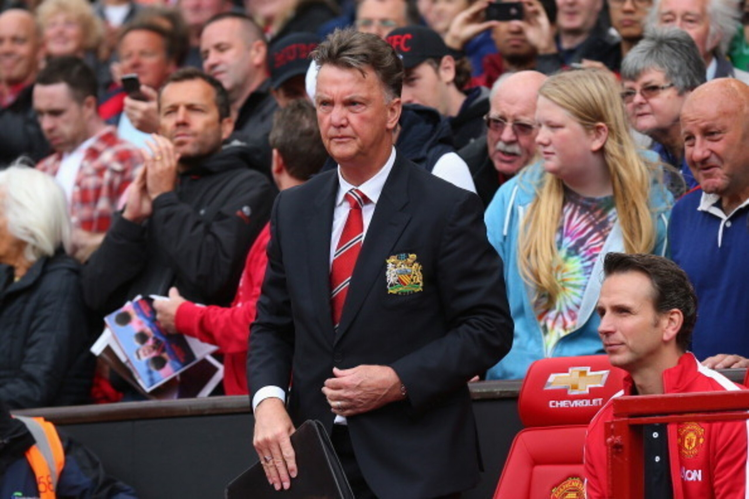 MANCHESTER, ENGLAND - AUGUST 16:  Manchester United Manager Louis van Gaal takes his seat prior to the Barclays Premier League match between Manchester United and Swansea City at Old Trafford on August 16, 2014 in Manchester, England.  (Photo by Alex Live