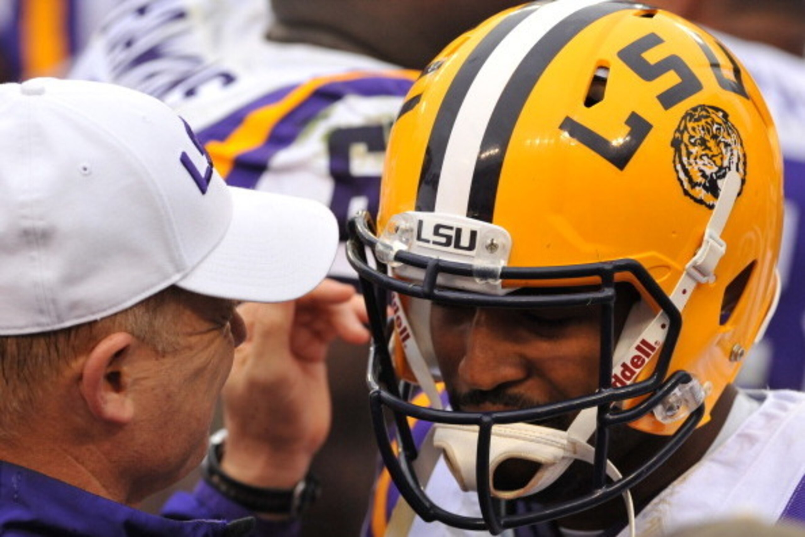 TAMPA, FL -  JANUARY 1:  Head coach Les Miles of the LSU Tigers celebrates with quarterback Anthony Jennings #10 after play against the Iowa Hawkeyes January 1, 2014  in the Outback Bowl at Raymond James Stadium in Tampa, Florida.  (Photo by Al Messerschm