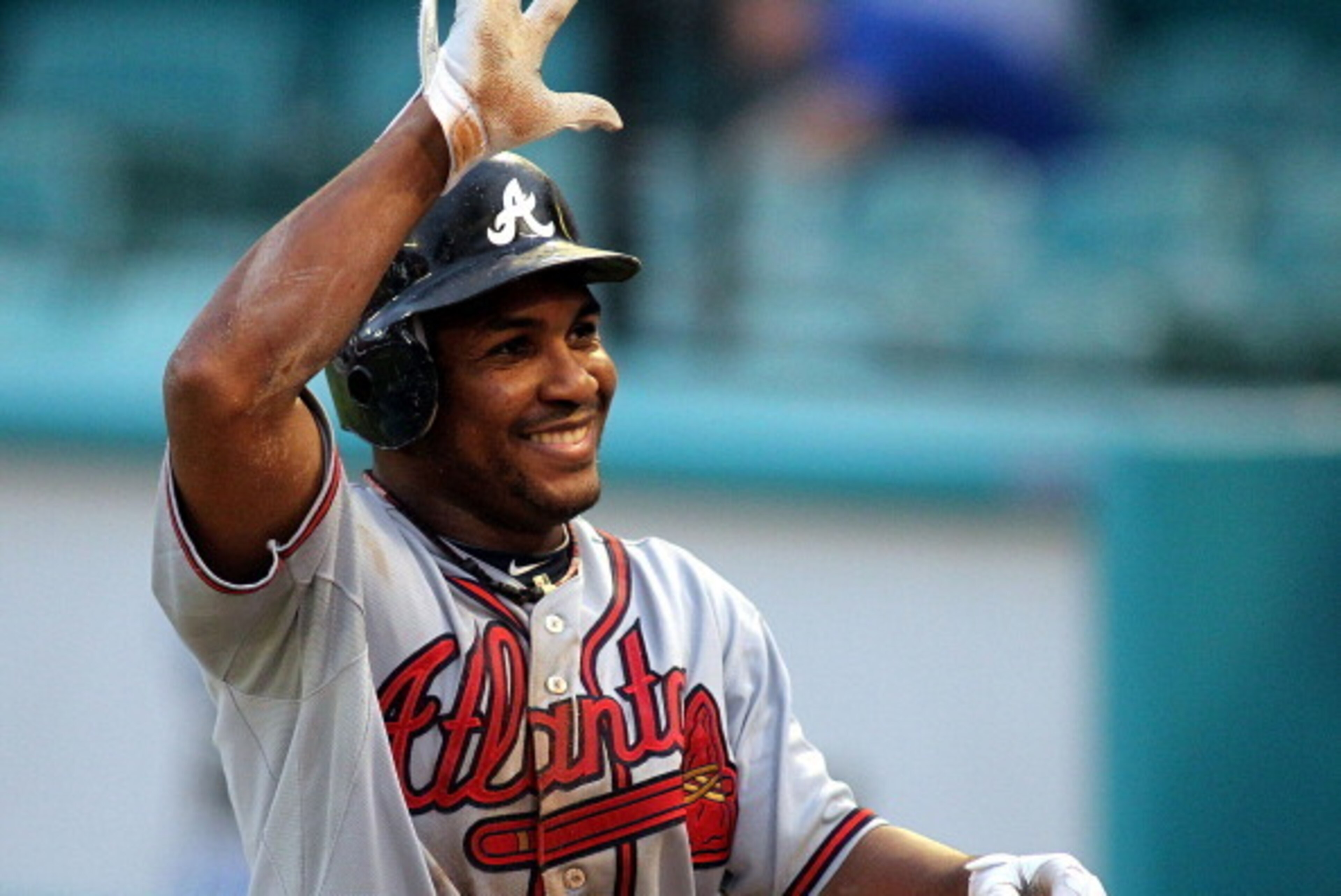 MIAMI GARDENS, FL - AUGUST 10:  Jose Constanza #17 of the Atlanta Braves celebrates scoring a run against the Florida Marlins at Sun Life Stadium on August 10, 2011 in Miami Gardens, Florida.  (Photo by Marc Serota/Getty Images)