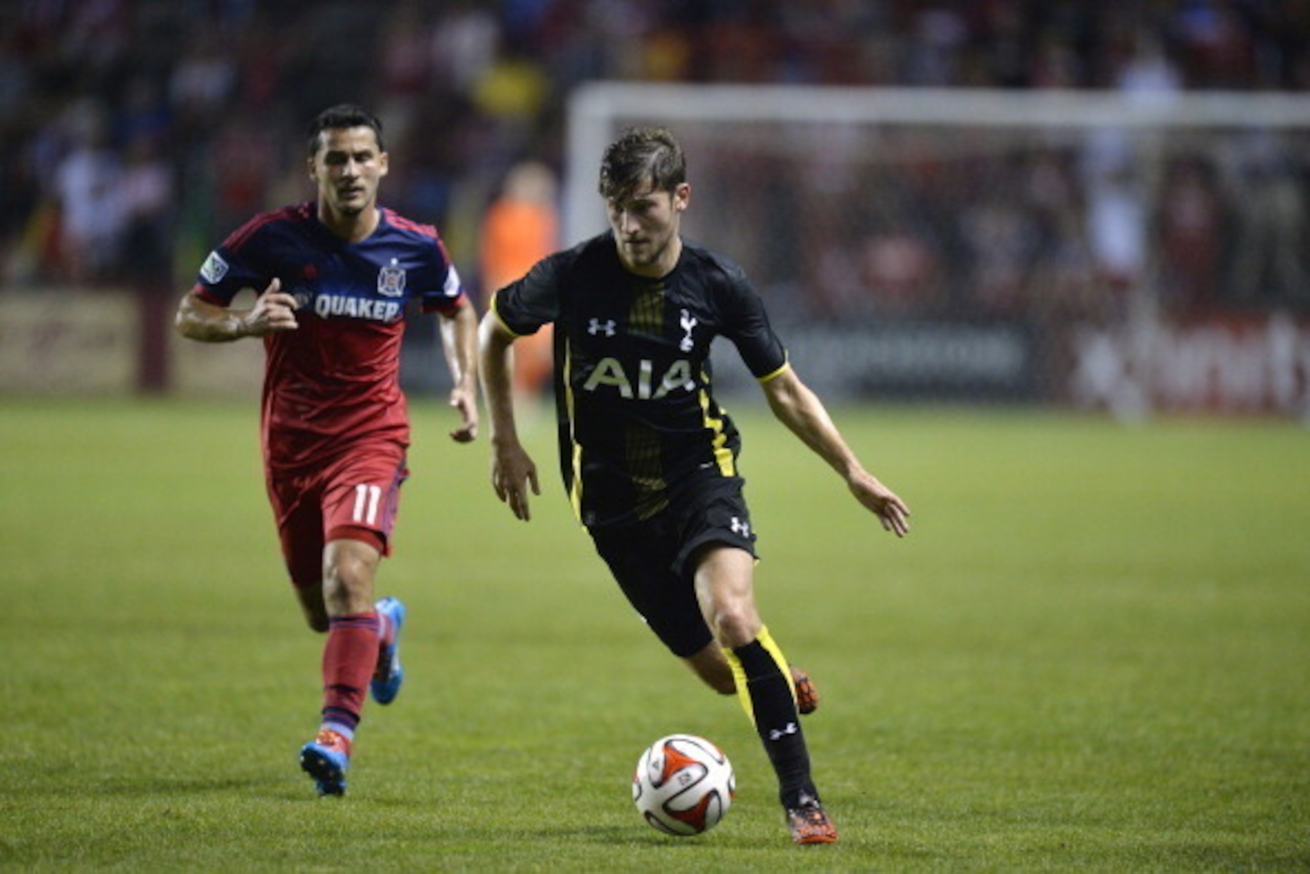 BRIDGEVIEW, IL - JULY 26:  Ben Davies #33 of Tottenham Hotspur (R) moves the ball as Dilly Duka #11 of the Chicago Fire defends during the second half at Toyota Park on July 26, 2014 in Bridgeview, Illinois. Tottenham Hotspur defeated the Fire 2-0.  (Phot