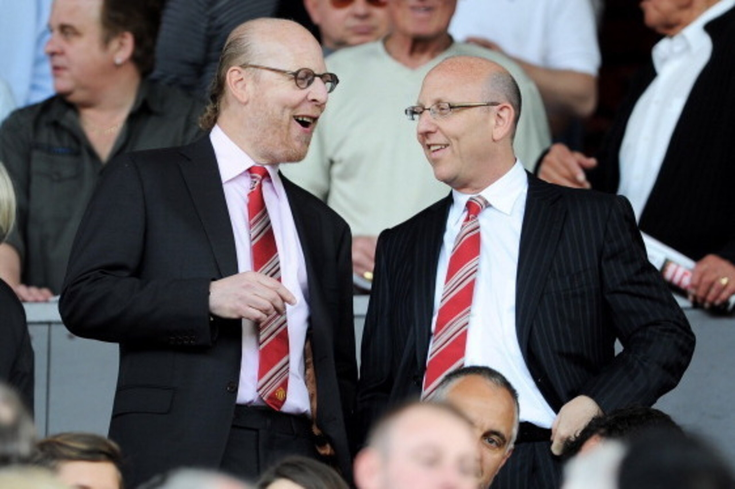 MANCHESTER, ENGLAND - APRIL 09: Manchester United Co-Chairmen Joel Glazer (R) and Avram Glazer talk during the Barclays Premier League match between Manchester United and Fulham at Old Trafford on April 9, 2011 in Manchester, England.  (Photo by Michael R
