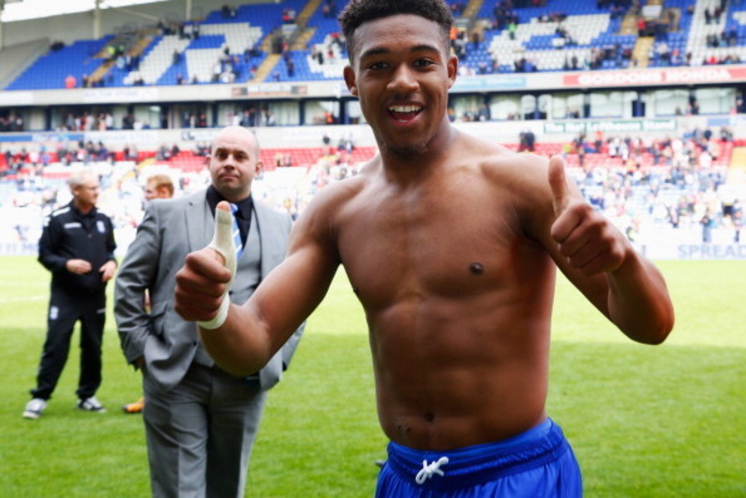 BOLTON, ENGLAND - MAY 03:  Jordon Ibe of Birmingham City celebrates as they avoid relegation after the Sky Bet Championship match between Bolton Wanderers and Birmingham City at Reebok Stadium on May 3, 2014 in Bolton, England.  (Photo by Paul Thomas/Gett
