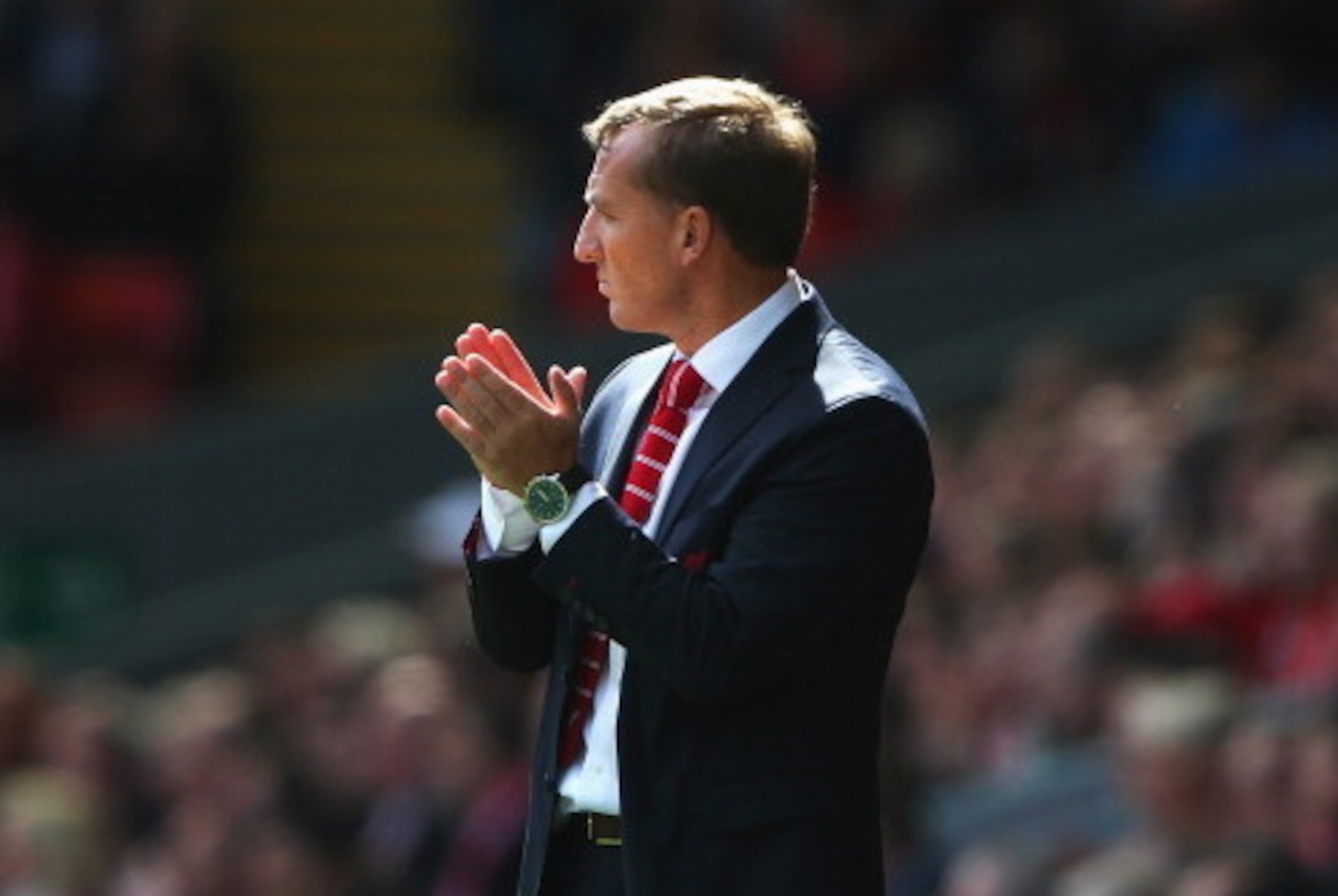LIVERPOOL, ENGLAND - AUGUST 17: Brendan Rodgers, manager of Liverpool applauds his team during the Barclays Premier League match between Liverpool and Southampton at Anfield on August 17, 2014 in Liverpool, England.  (Photo by Alex Livesey/Getty Images)