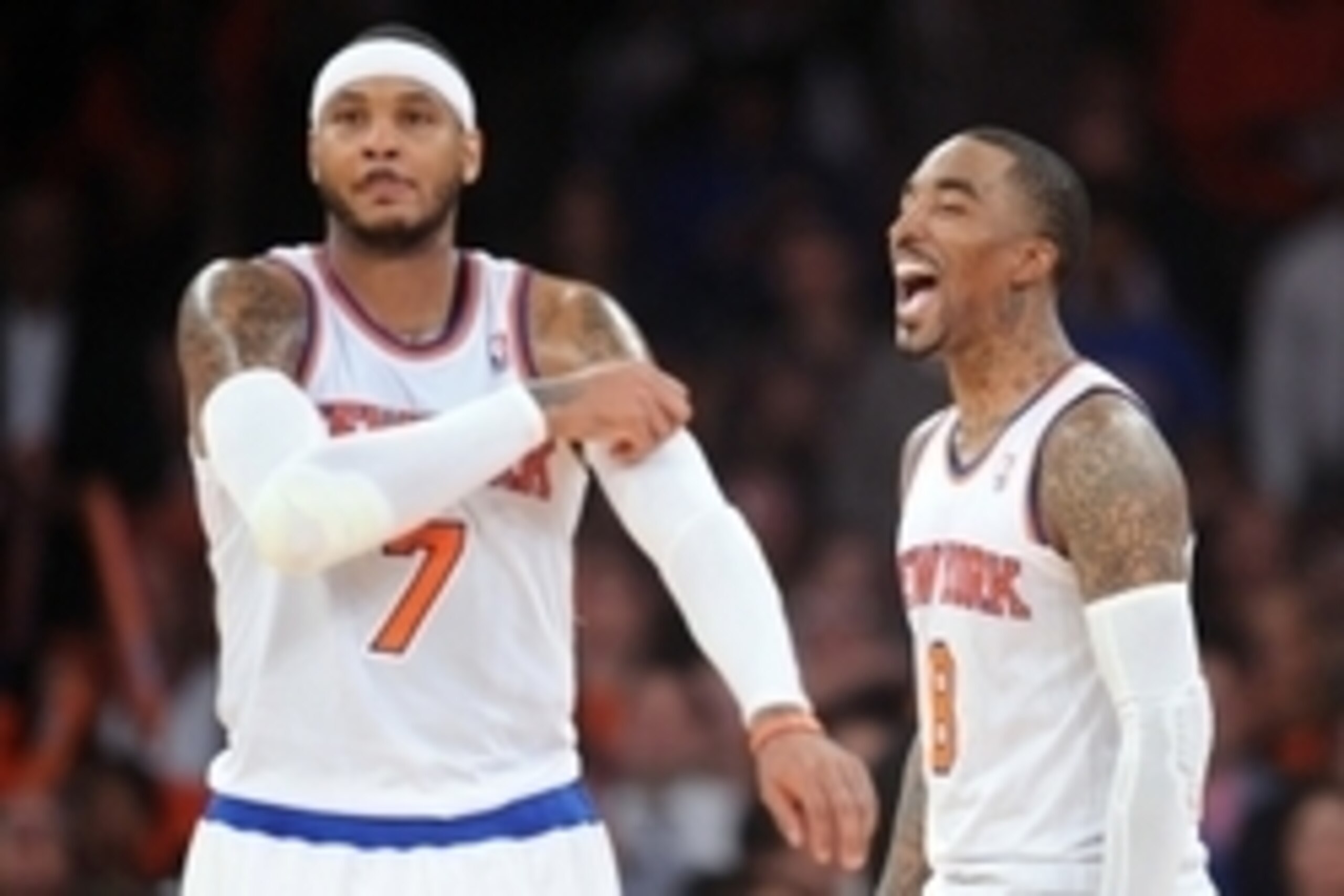 Apr 2, 2014; New York, NY, USA; New York Knicks guard J.R. Smith (8) and forward Carmelo Anthony (7) look on against the Brooklyn Nets during the second half at Madison Square Garden. The New York Knicks won 110-81. Mandatory Credit: Joe Camporeale-USA TO