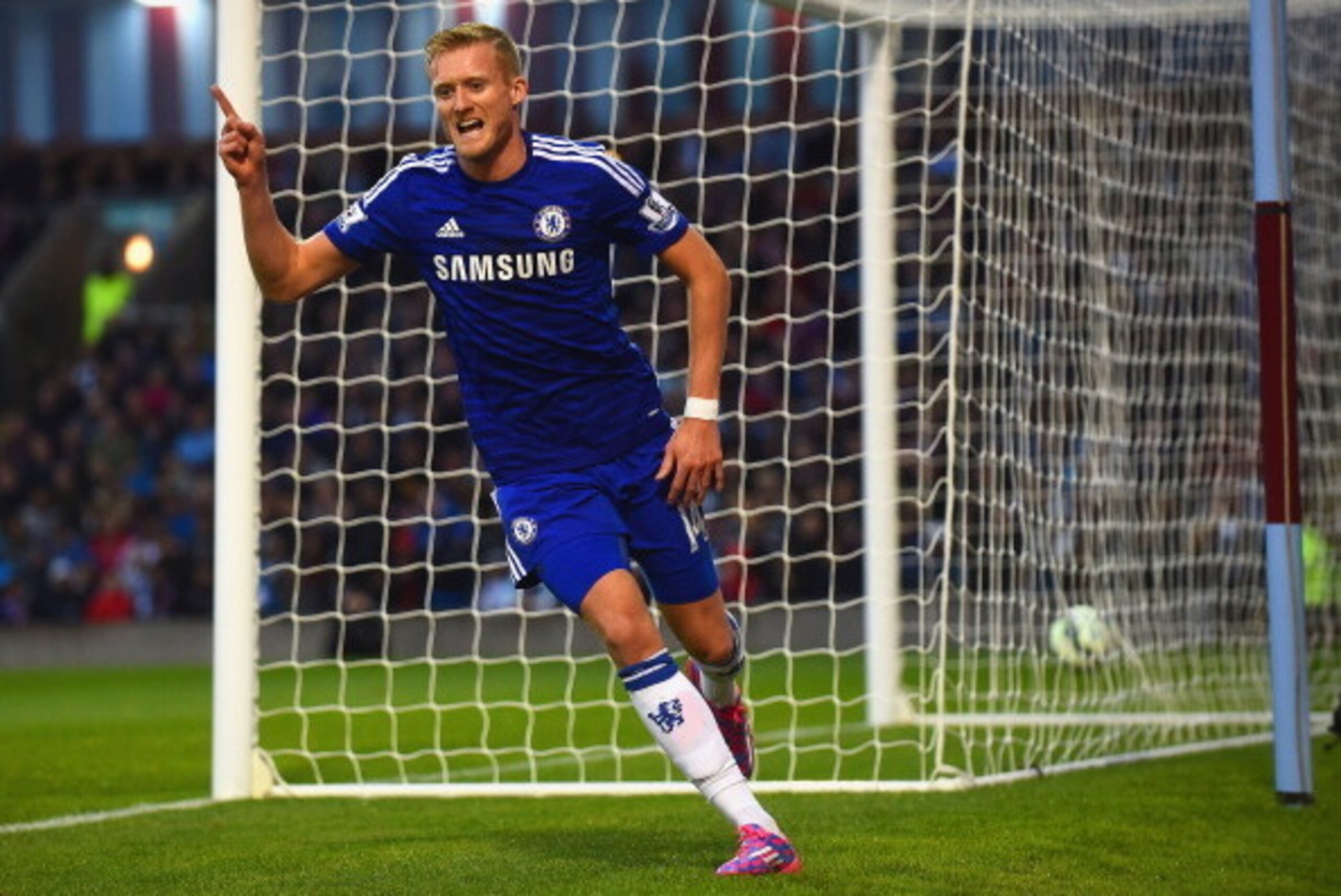 BURNLEY, ENGLAND - AUGUST 18:  Andre Schurrle of Chelsea celebrates scoring their second goal during the Barclays Premier League match between Burnley and Chelsea at Turf Moor on August 18, 2014 in Burnley, England.  (Photo by Laurence Griffiths/Getty Ima