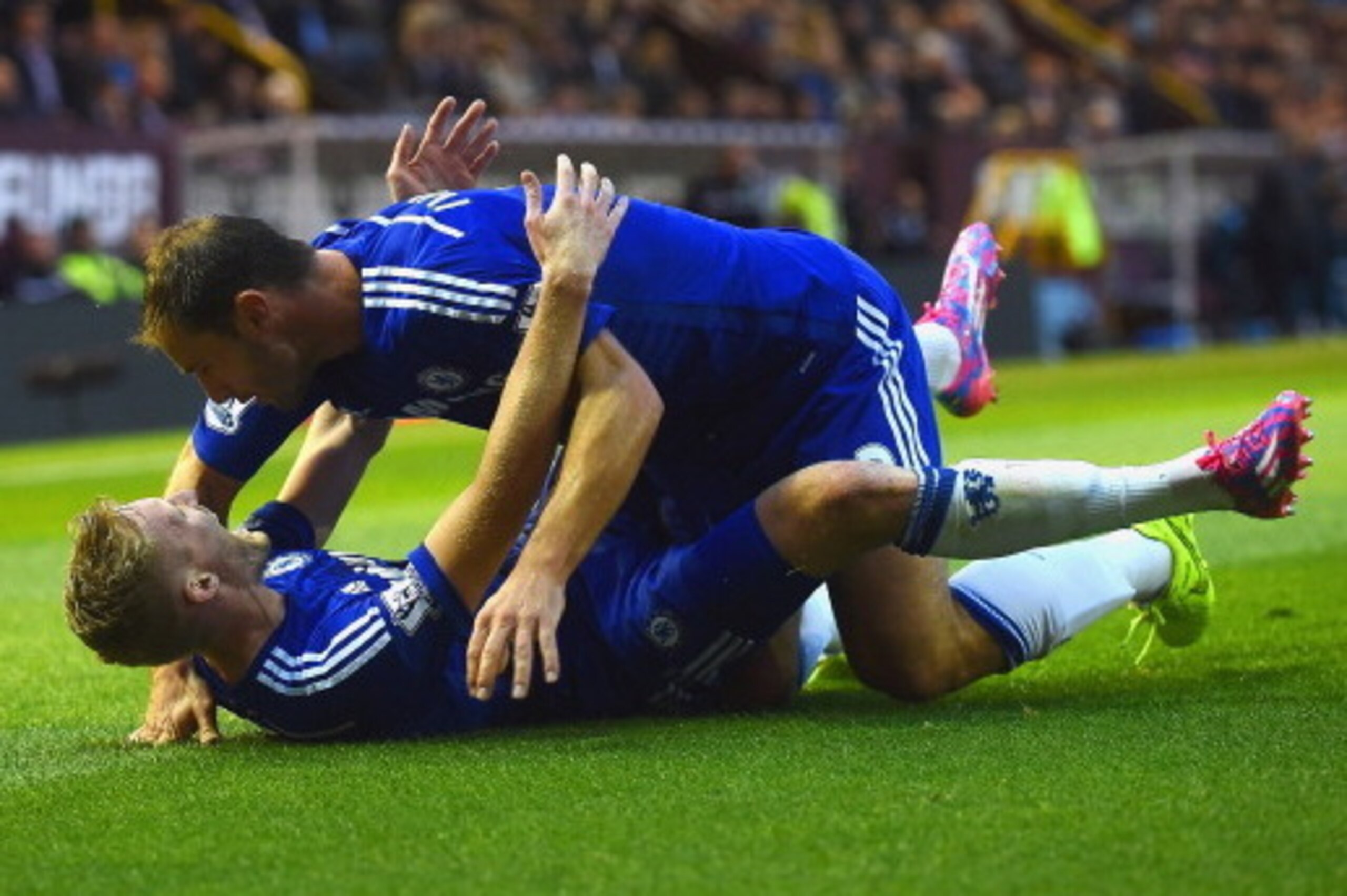 BURNLEY, ENGLAND - AUGUST 18:  Andre Schurrle of Chelsea celebrates scoring their second goal with Branislav Ivanovic of Chelsea during the Barclays Premier League match between Burnley and Chelsea at Turf Moor on August 18, 2014 in Burnley, England.  (Ph