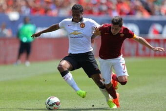 DENVER, CO - JULY 26: Antonio Valencia #25 of Manchester United battles for the ball with Juan Iturbe #7 of AS Roma during the first half of an International Champions Cup match at Sports Authority Field at Mile High on July 26, 2014 in Denver, Colorado. 