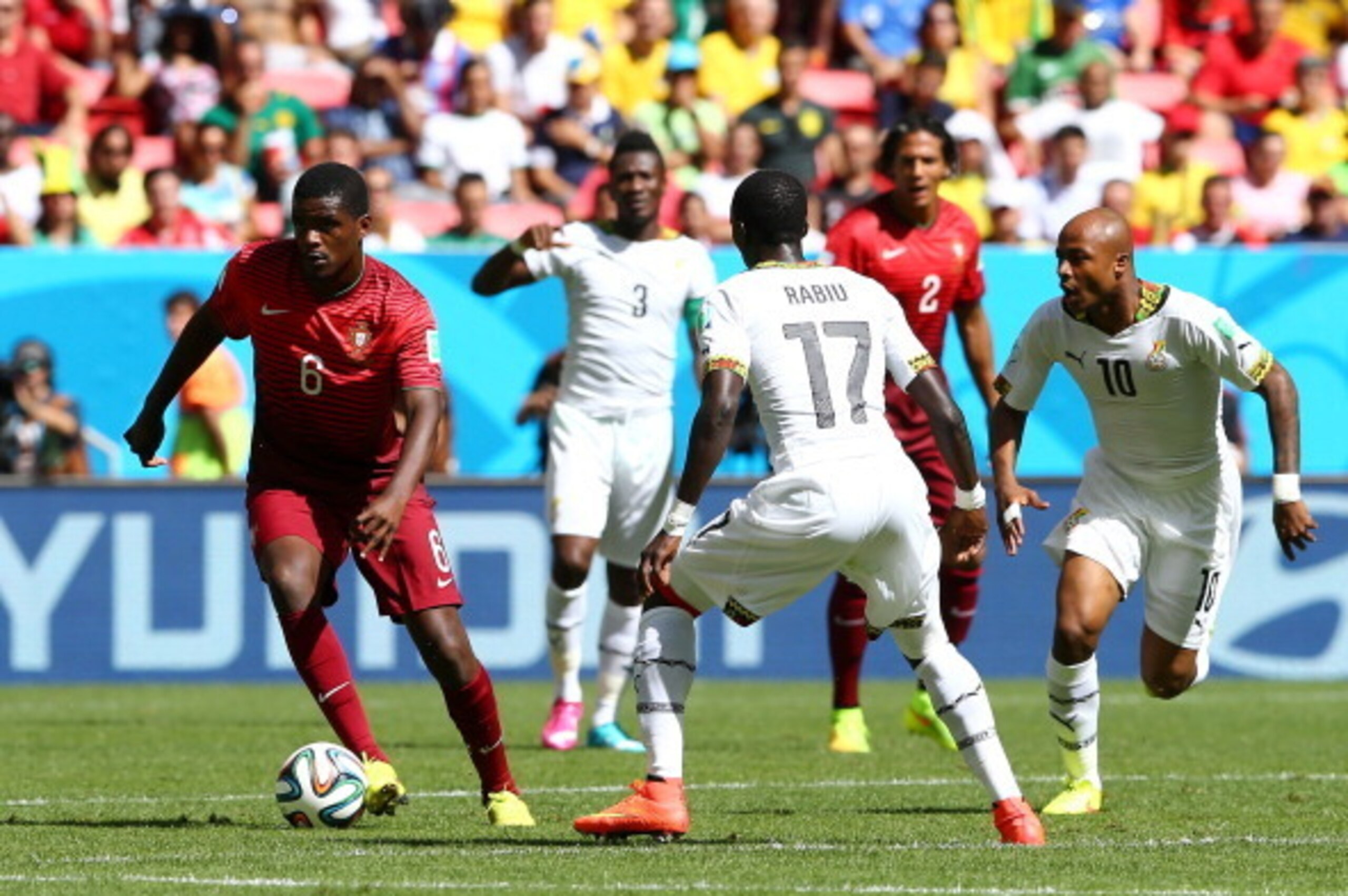 BRASILIA, BRAZIL - JUNE 26:  William Carvalho of Portugal controls the ball past Andre Ayew of Ghana during the 2014 FIFA World Cup Brazil Group G match between Portugal and Ghana at Estadio Nacional on June 26, 2014 in Brasilia, Brazil.  (Photo by Elsa/G