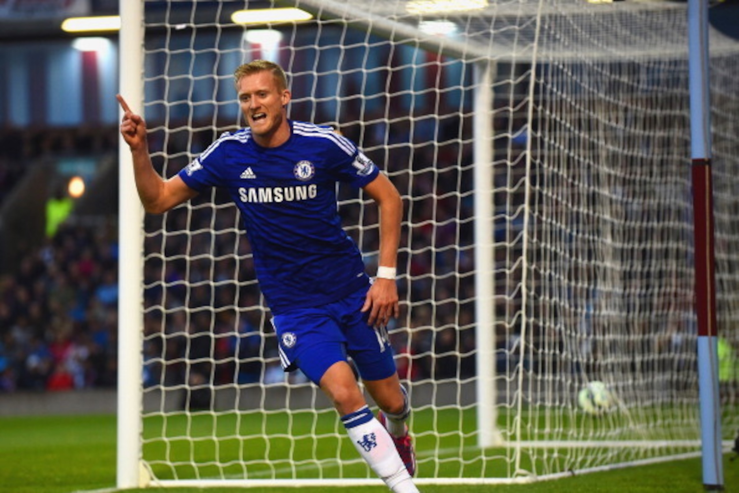BURNLEY, ENGLAND - AUGUST 18:  Andre Schurrle of Chelsea celebrates scoring their second goal during the Barclays Premier League match between Burnley and Chelsea at Turf Moor on August 18, 2014 in Burnley, England.  (Photo by Laurence Griffiths/Getty Ima