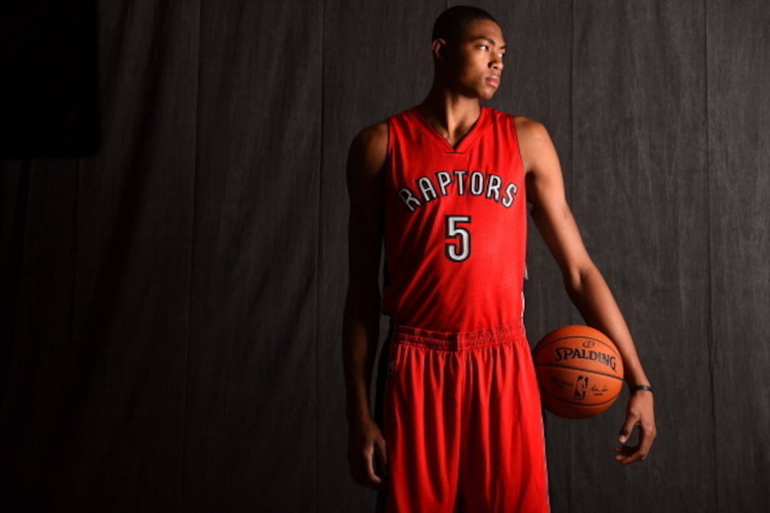 TARRYTOWN, NY - AUGUST 3:  Bruno Caboclo #5 of the Toronto Raptors poses for a portrait during the 2014 NBA rookie photo shoot on August 3, 2014 at the Madison Square Garden Training Facility in Tarrytown, New York. NOTE TO USER: User expressly acknowledg