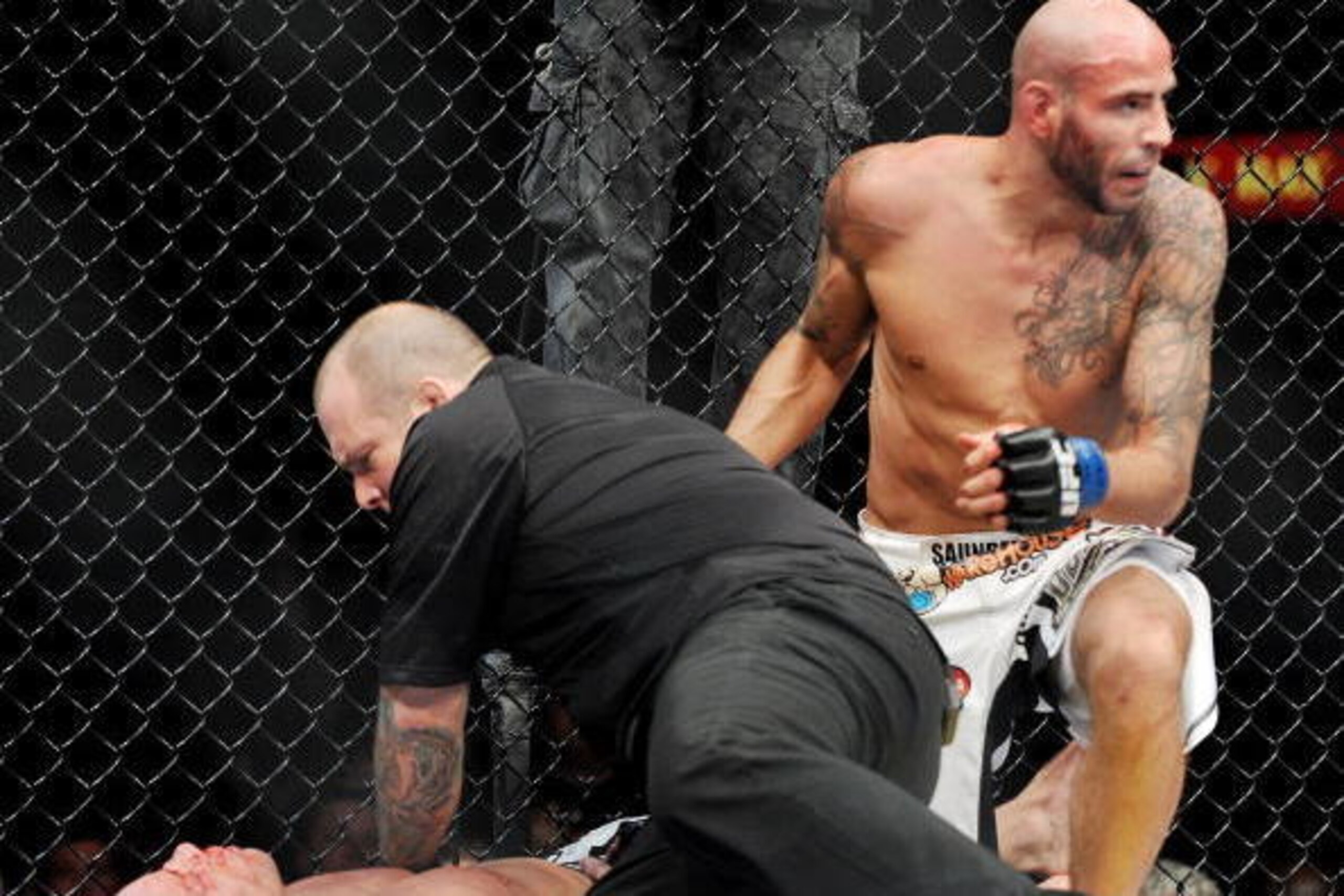 LAS VEGAS - NOVEMBER 21: Ben Saunders (R) knocks out Marcus Davis (L) during their Welterweight Fight at the UFC 106 at Mandalay Bay Events Center on November 21, 2009 in Las Vegas, Nevada. (Photo by Jon Kopaloff/Getty Images)