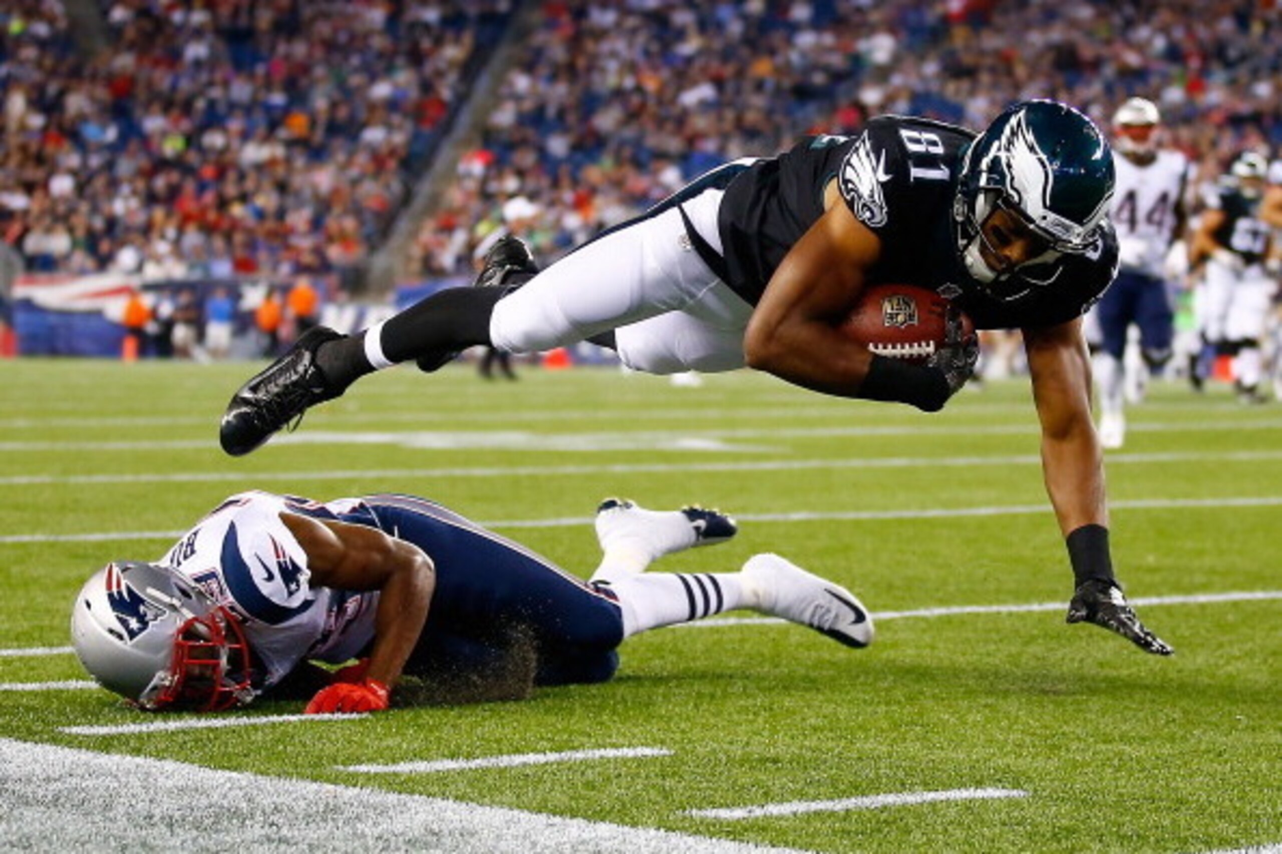 FOXBORO, MA - AUGUST 15: Jordan Matthews #81 of the Philadelphia Eagles is tackled by Malcolm Butler #29 of the New England Patriots in the second half during the preseason game at Gillette Stadium on August 15, 2014 in Foxboro, Massachusetts.  (Photo by 
