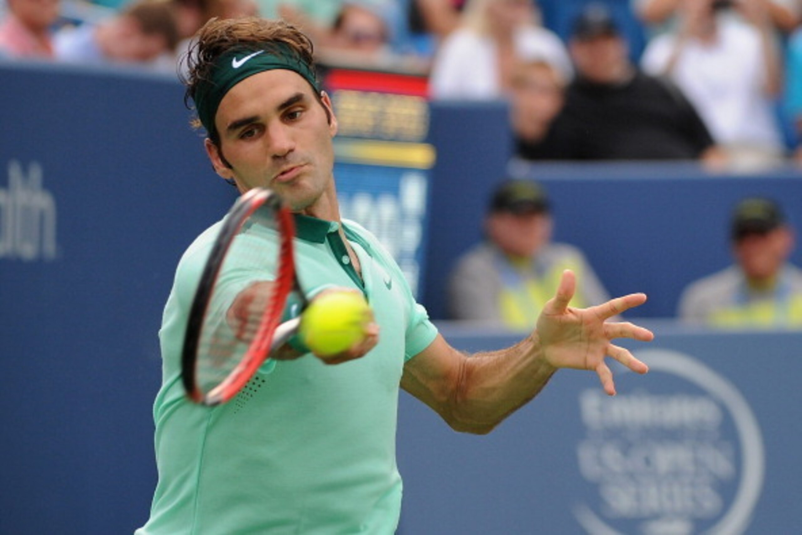 CINCINNATI, OH - AUGUST 17:  Roger Federer of Switzerland returns to David Ferrer of Spain during a final match on day 9 of the Western & Southern Open at the Linder Family Tennis Center on August 17, 2014 in Cincinnati, Ohio.  (Photo by Jonathan Moore/Ge