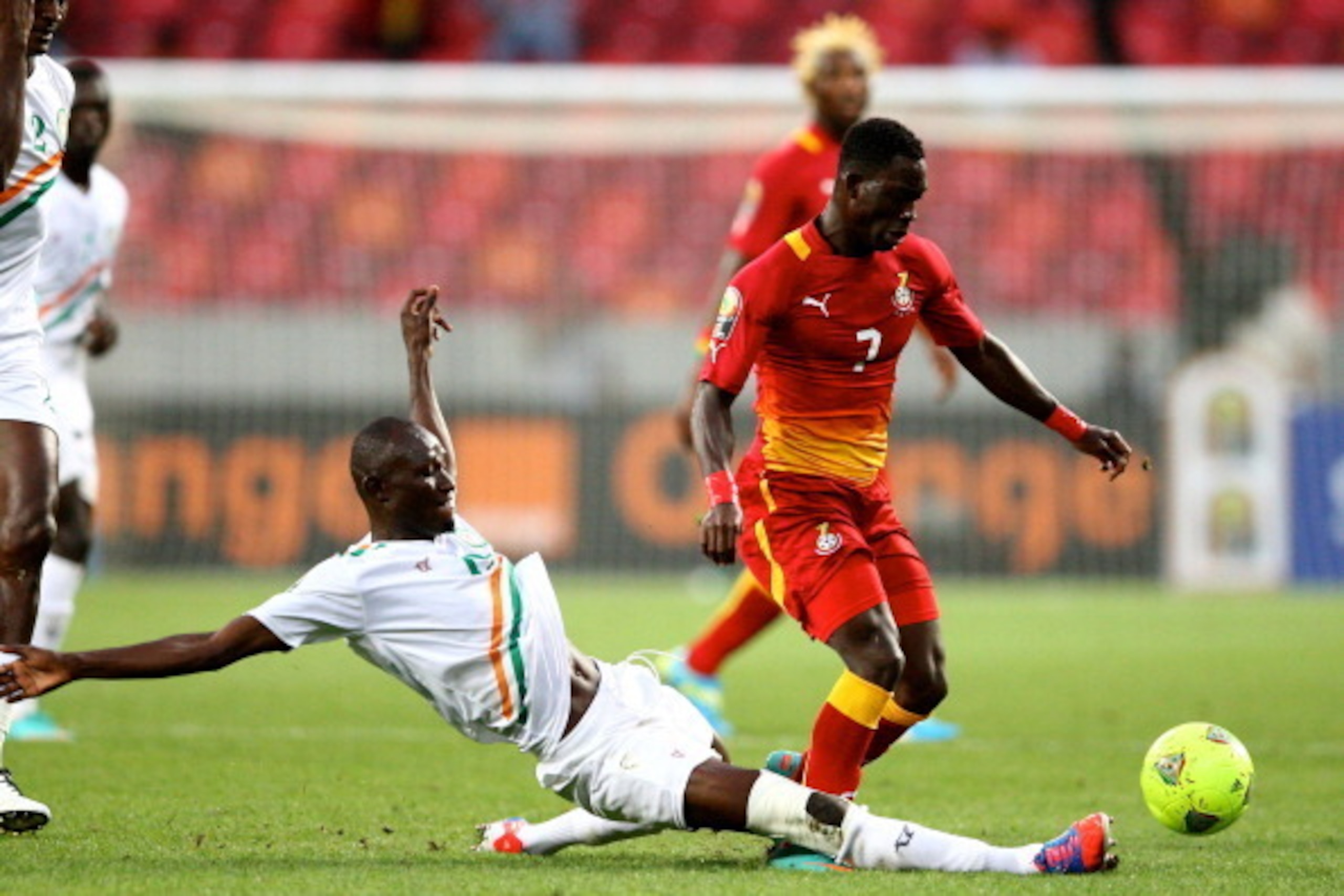 PORT ELIZABETH, SOUTH AFRICA - JANUARY 28, Dankwa Kofi of Niger (L) and Christian Atsu Twasam of Ghana during the 2013 Orange African Cup of Nations match between Niger and Ghana from Nelson Mandela Bay Stadium on January 28, 2013 in Port Elizabeth, South
