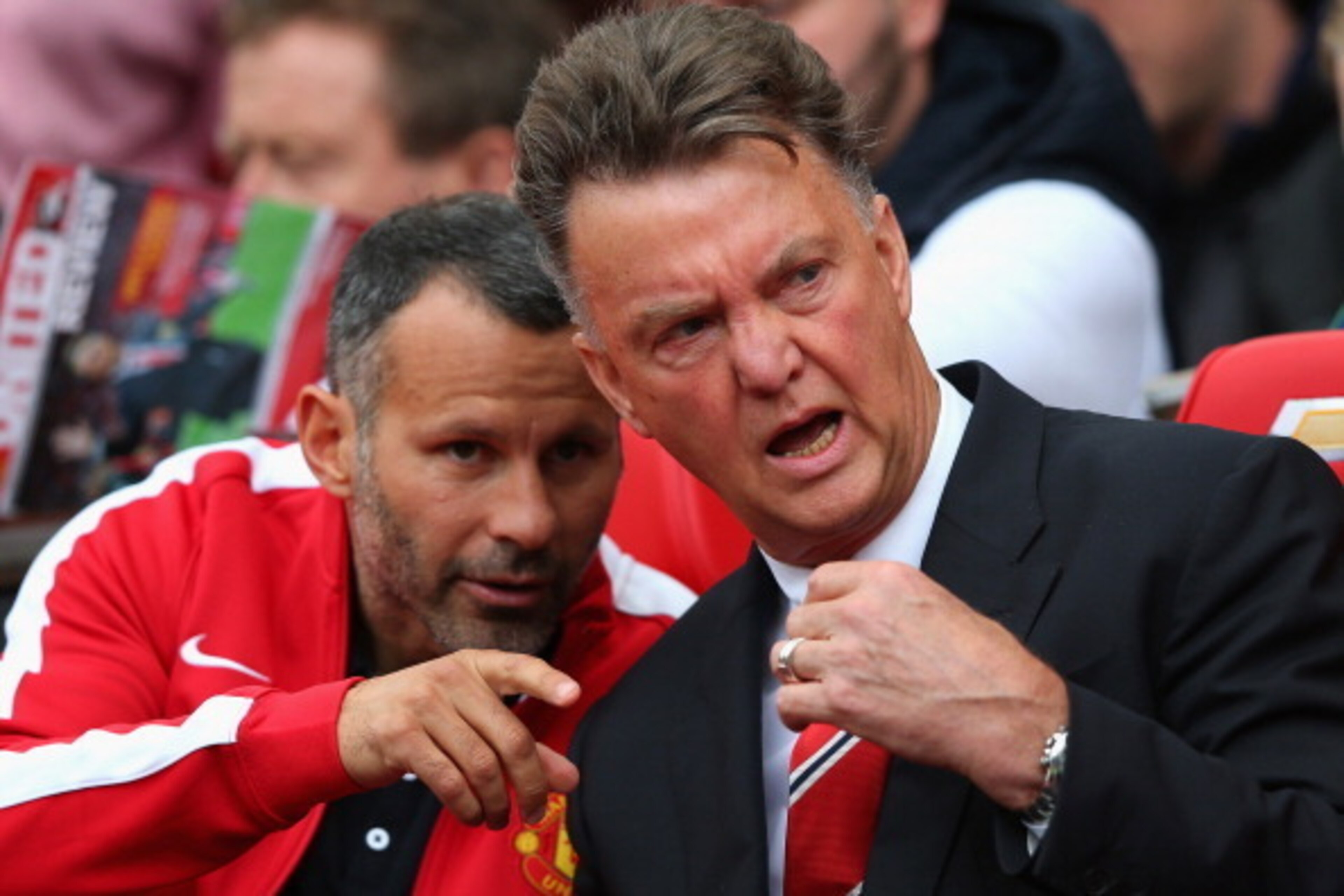 MANCHESTER, ENGLAND - AUGUST 16:  Manchester United Manager Louis van Gaal speaks with Assistant Ryan Giggs (L) prior to the Barclays Premier League match between Manchester United and Swansea City at Old Trafford on August 16, 2014 in Manchester, England