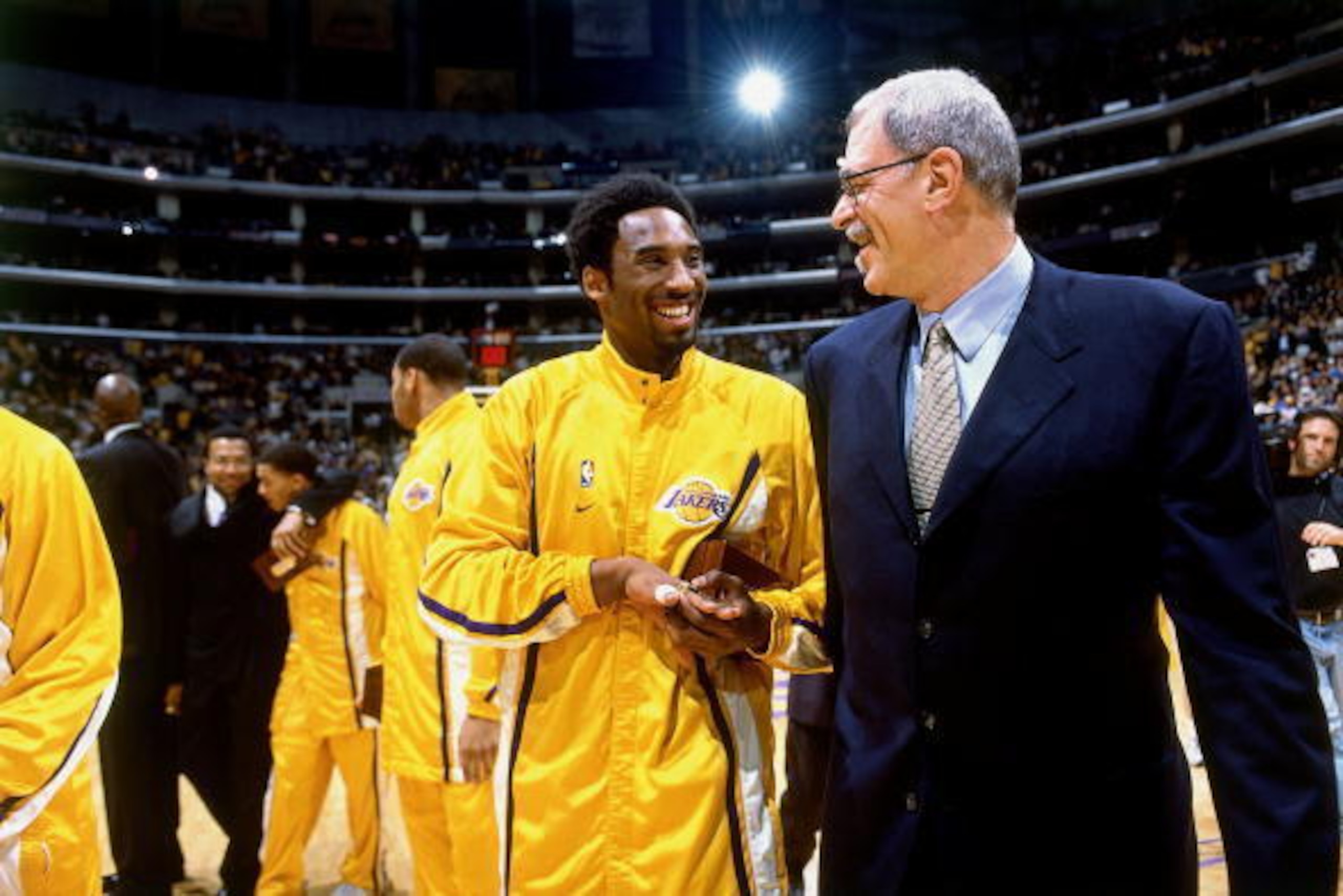 LOS ANGELES - 2001: Kobe Bryant #8 of the Los Angeles Lakers has a laugh with Lakers head coach Phil Jackson before a 2001 NBA game at the Staples Center in Los Angeles, California. NOTE TO USER: User expressly acknowledges that, by downloading and or us LOS ANGELES - 2001: Kobe Bryant #8 of the Los Angeles Lakers has a laugh with Lakers head coach Phil Jackson before a 2001 NBA game at the Staples Center in Los Angeles, California. NOTE TO USER: User expressly acknowledges that, by downloading and or us
