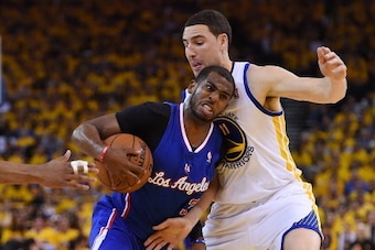 OAKLAND, CA - APRIL 27:  Chris Paul #3 of the Los Angeles Clippers drives on Klay Thompson #11 of the Golden State Warriors in Game Four of the Western Conference Quarterfinals during the 2014 NBA Playoffs at ORACLE Arena on April 27, 2014 in Oakland, Cal