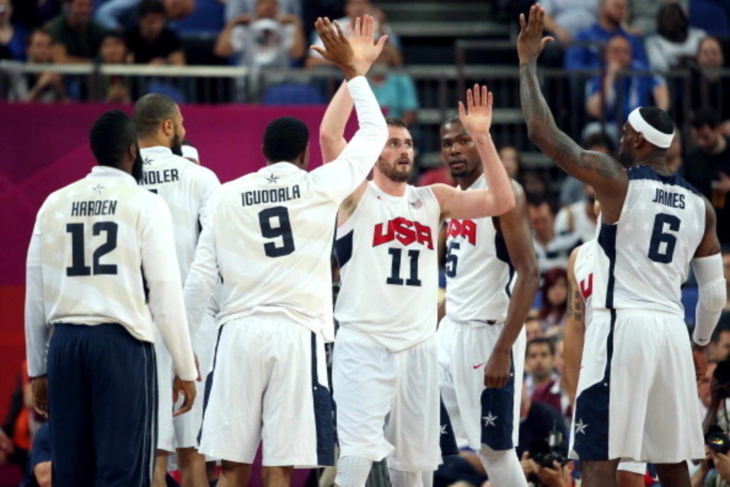 LONDON, ENGLAND - AUGUST 08:  Andre Iguodala #9, Kevin Love #11 and LeBron James #6 of United States celebrate late in the fourth quarter while taking on Australia during the Men's Basketball quaterfinal game on Day 12 of the London 2012 Olympic Games at 