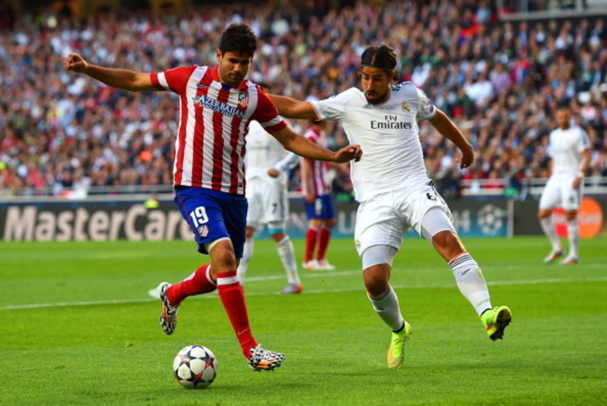LISBON, PORTUGAL - MAY 24:  Diego Costa of Club Atletico de Madrid is marshalled by Sami Khedira of Real Madrid during the UEFA Champions League Final between Real Madrid and Atletico de Madrid at Estadio da Luz on May 24, 2014 in Lisbon, Portugal.  (Phot