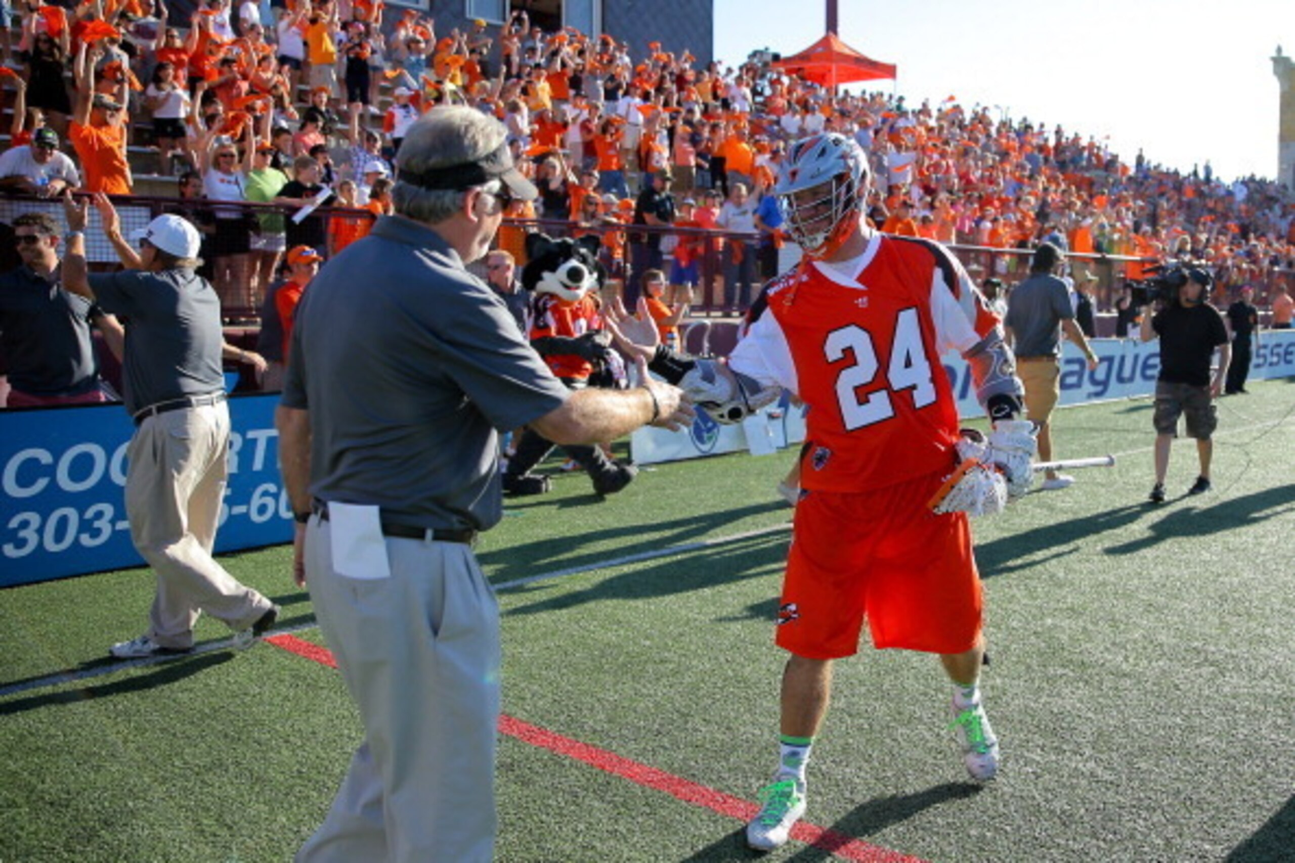 DENVER, CO - AUGUST 16: John Grant Jr. #24 of the Denver Outlaws celebrates with head coach B.J. O'Hara after they defeated the New York Lizards 14-13 during a Major League Lacrosse semifinal game at Peter Barton Stadium on August 16, 2014 in Denver, Colo