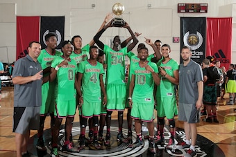 Thon Maker (34) holds up the 2014 Adidas Nations championship trophy with Team Lillard.
