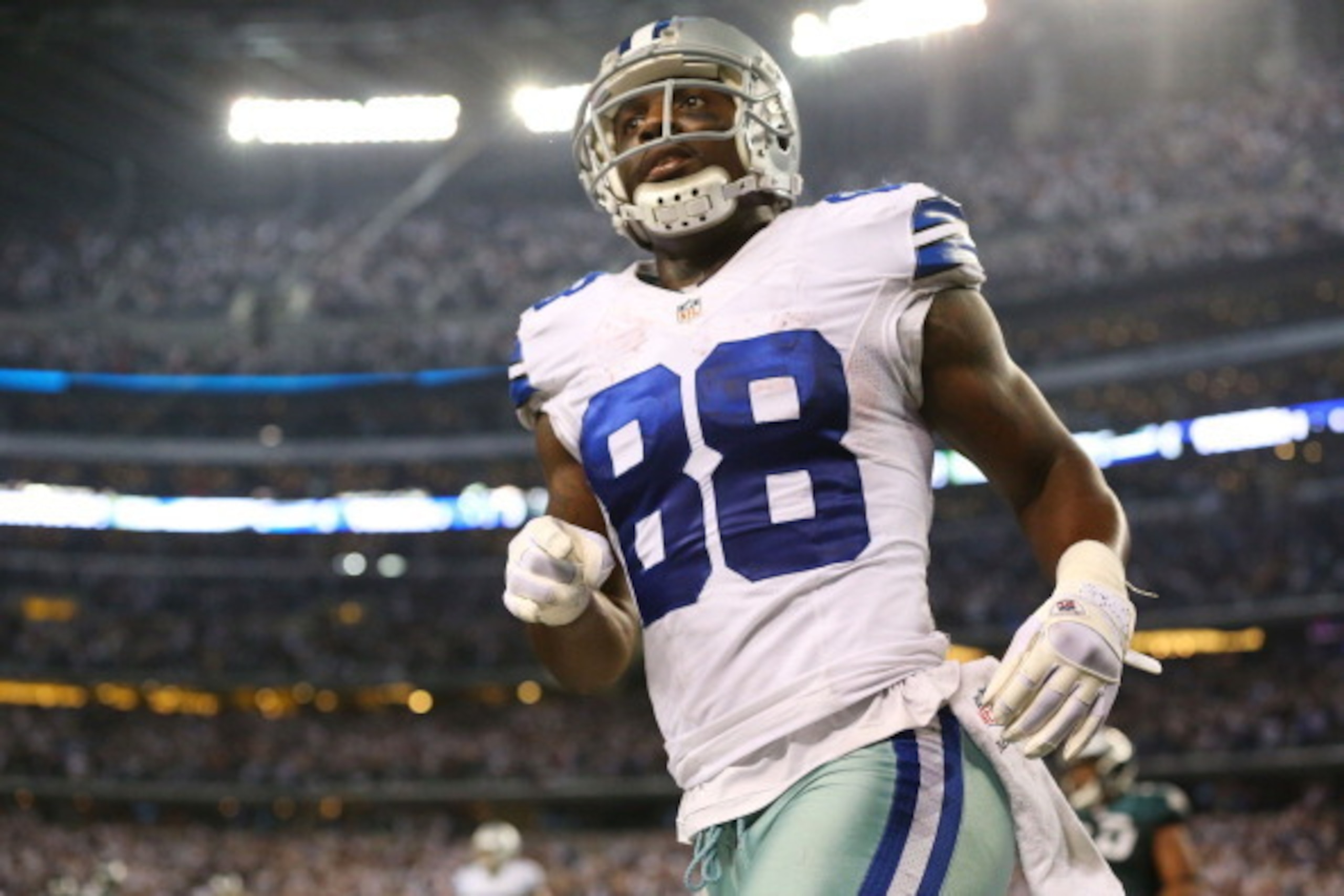 ARLINGTON, TX - DECEMBER 29:   Dez Bryant #88 of the Dallas Cowboys runs off of the field in the second half against the Philadelphia Eagles at Cowboys Stadium on December 29, 2013 in Arlington, Texas.  (Photo by Ronald Martinez/Getty Images)