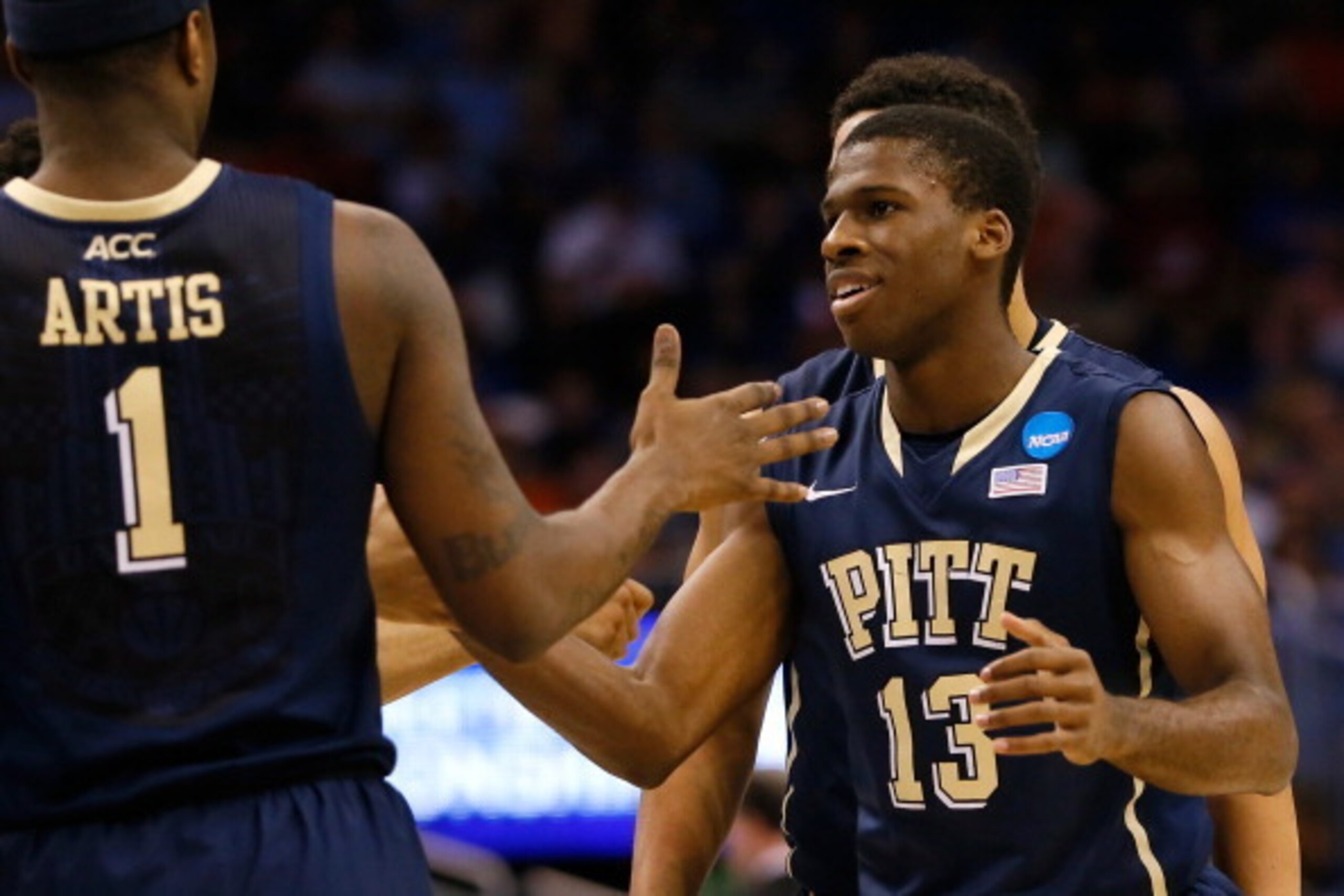 ORLANDO, FL - MARCH 22: Josh Newkirk #13 celebrates with Jamel Artis #1 of the Pittsburgh Panthers in the first half while taking on the Florida Gators during the third round of the 2014 NCAA Men's Basketball Tournament at Amway Center on March 22, 2014 ORLANDO, FL - MARCH 22: Josh Newkirk #13 celebrates with Jamel Artis #1 of the Pittsburgh Panthers in the first half while taking on the Florida Gators during the third round of the 2014 NCAA Men's Basketball Tournament at Amway Center on March 22, 2014