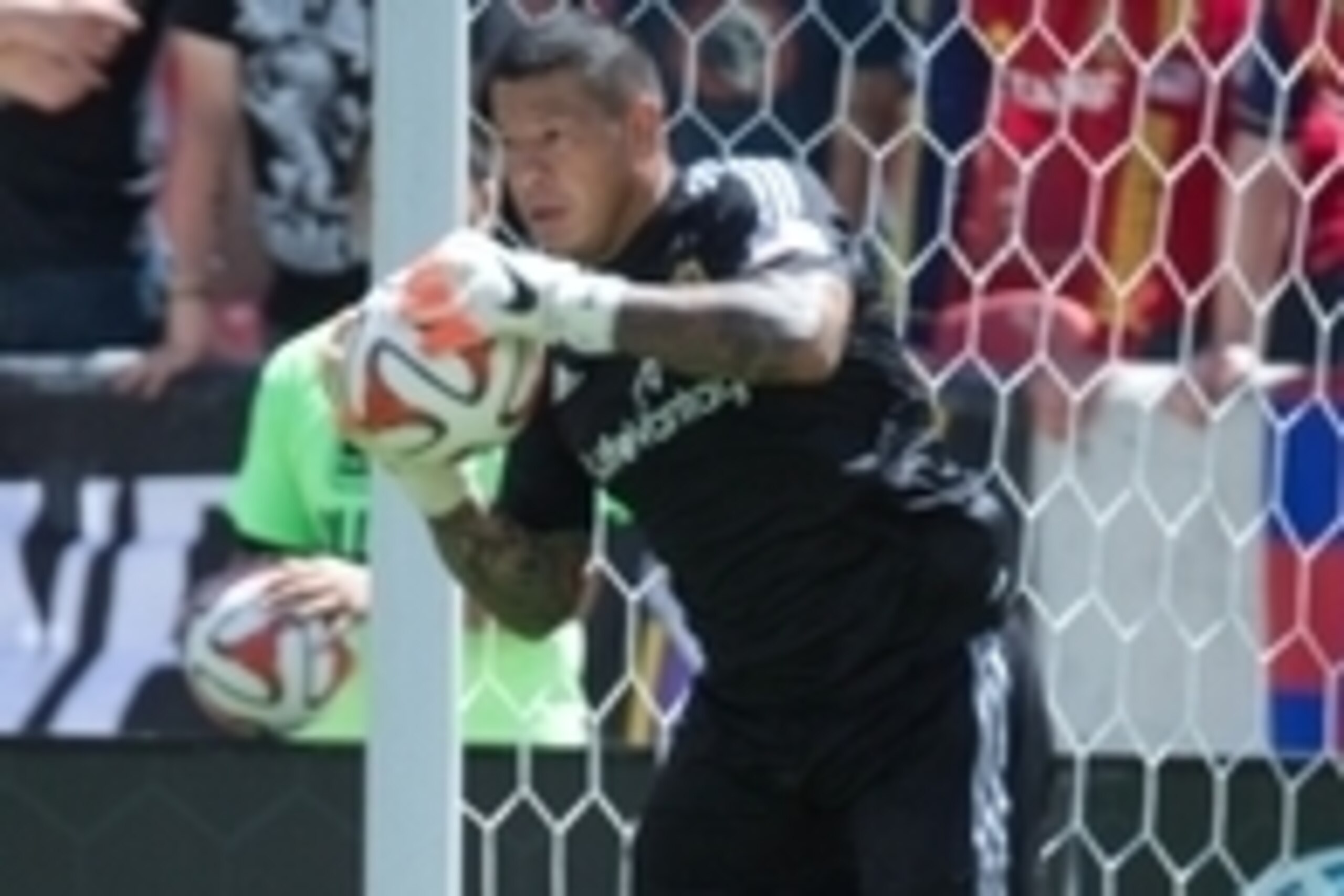 Aug 16, 2014; Sandy, UT, USA; Real Salt Lake goalkeeper Nick Rimando (18) makes a save during the first half against the Seattle Sounders FC at Rio Tinto Stadium. Mandatory Credit: Russ Isabella-USA TODAY Sports