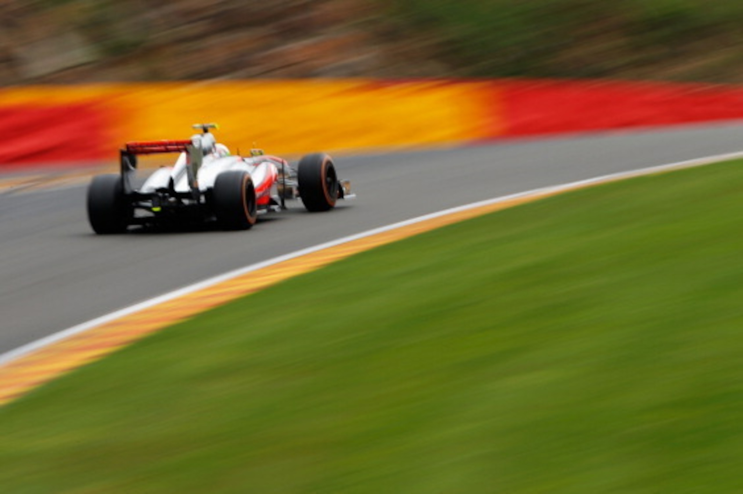 SPA, BELGIUM - AUGUST 25:  Sergio Perez of Mexico and McLaren drives during the Belgian Grand Prix at Circuit de Spa-Francorchamps on August 25, 2013 in Spa, Belgium.  (Photo by Dean Mouhtaropoulos/Getty Images)