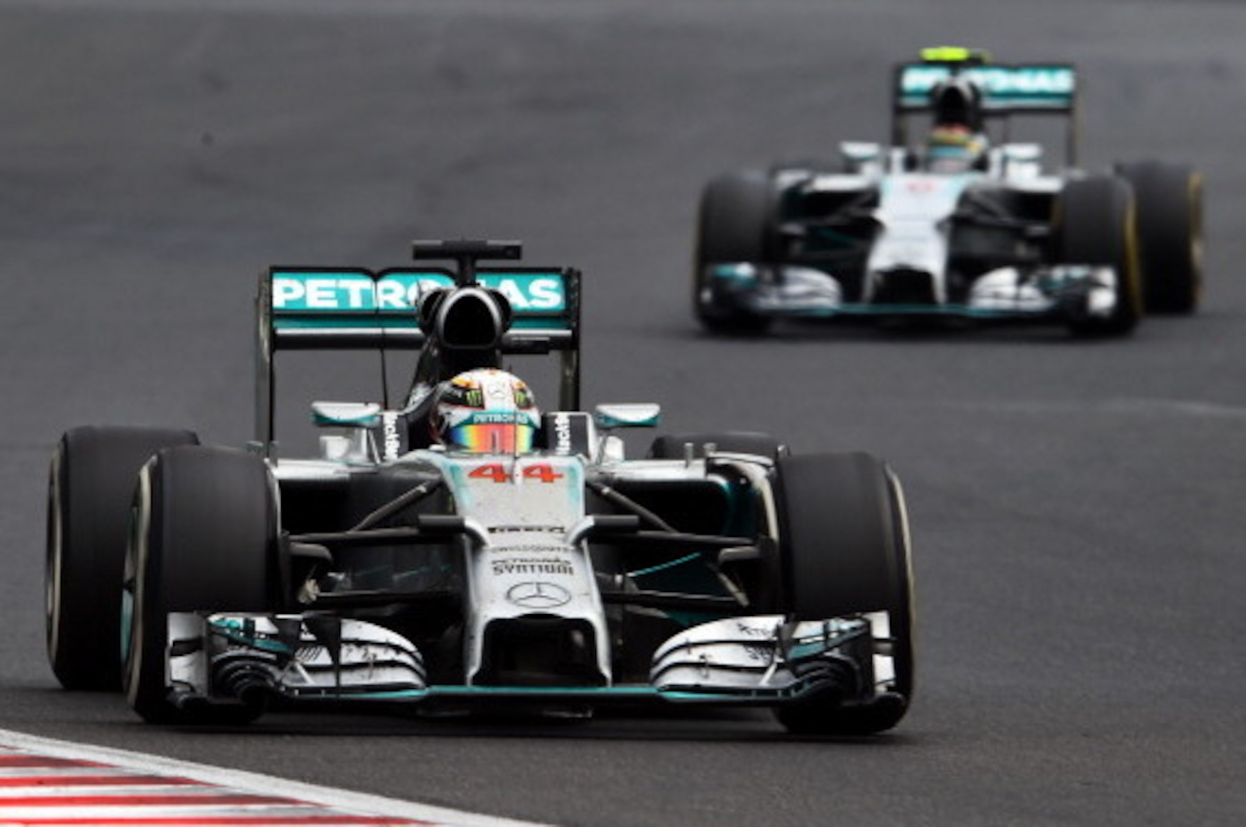 BUDAPEST, HUNGARY - JULY 27:  Lewis Hamilton of Great Britain and Mercedes GP leads Nico Rosberg of Germany and Mercedes GP during the Hungarian Formula One Grand Prix at Hungaroring on July 27, 2014 in Budapest, Hungary.  (Photo by Lars Baron/Getty Image