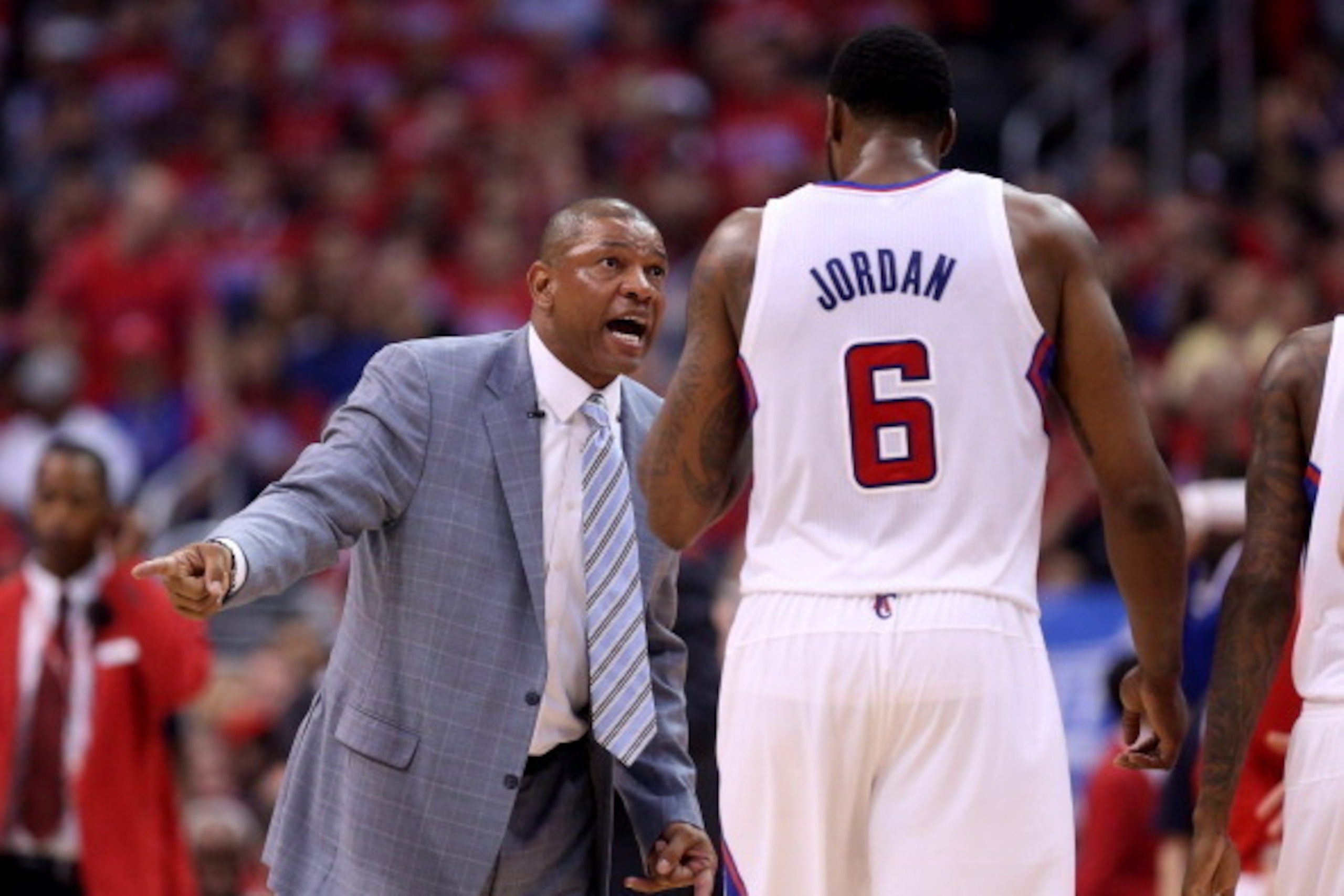 LOS ANGELES, CA - APRIL 19:  Head coach Doc Rivers of the Los Angeles Clippers talks to DeAndre Jordan #6 during the game against the Golden State Warriors in Game One of the Western Conference Quarterfinals during the 2014 NBA Playoffs at Staples Center 