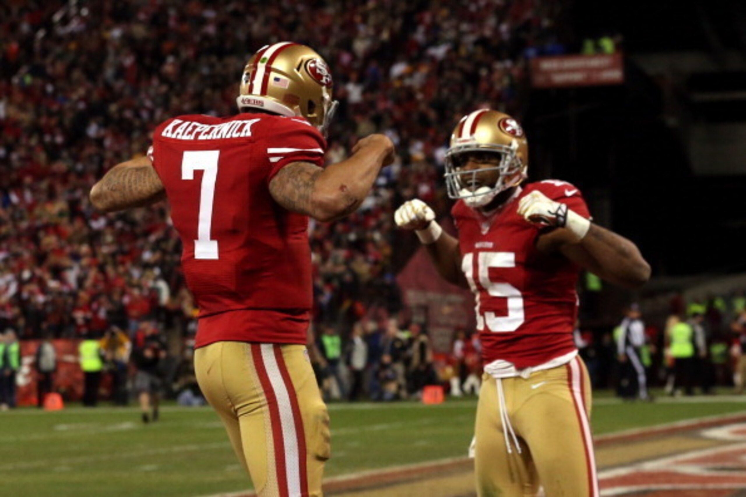 SAN FRANCISCO, CA - JANUARY 12: Quarterback Colin Kaepernick #7 of the San Francisco 49ers celebrates with wide receiver Michael Crabtree #15 after running the ball for a touchdown against the Green Bay Packers in the third quarter during the NFC Divisio SAN FRANCISCO, CA - JANUARY 12: Quarterback Colin Kaepernick #7 of the San Francisco 49ers celebrates with wide receiver Michael Crabtree #15 after running the ball for a touchdown against the Green Bay Packers in the third quarter during the NFC Divisio