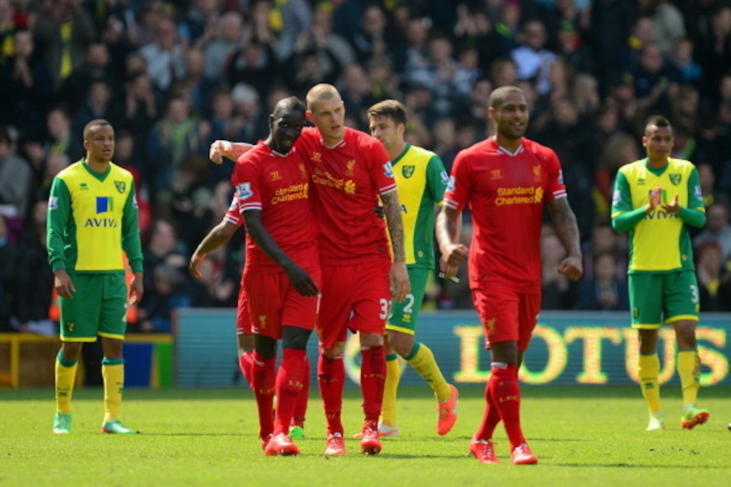 NORWICH, ENGLAND - APRIL 20: Mamadou Sakho hugs Martin Skrtel of Liverpool at the final whistle during the Barclays Premier League match between Norwich City and Liverpool at Carrow Road on April 20, 2014 in Norwich, England. (Photo by Jamie McDonald/G NORWICH, ENGLAND - APRIL 20: Mamadou Sakho hugs Martin Skrtel of Liverpool at the final whistle during the Barclays Premier League match between Norwich City and Liverpool at Carrow Road on April 20, 2014 in Norwich, England. (Photo by Jamie McDonald/G