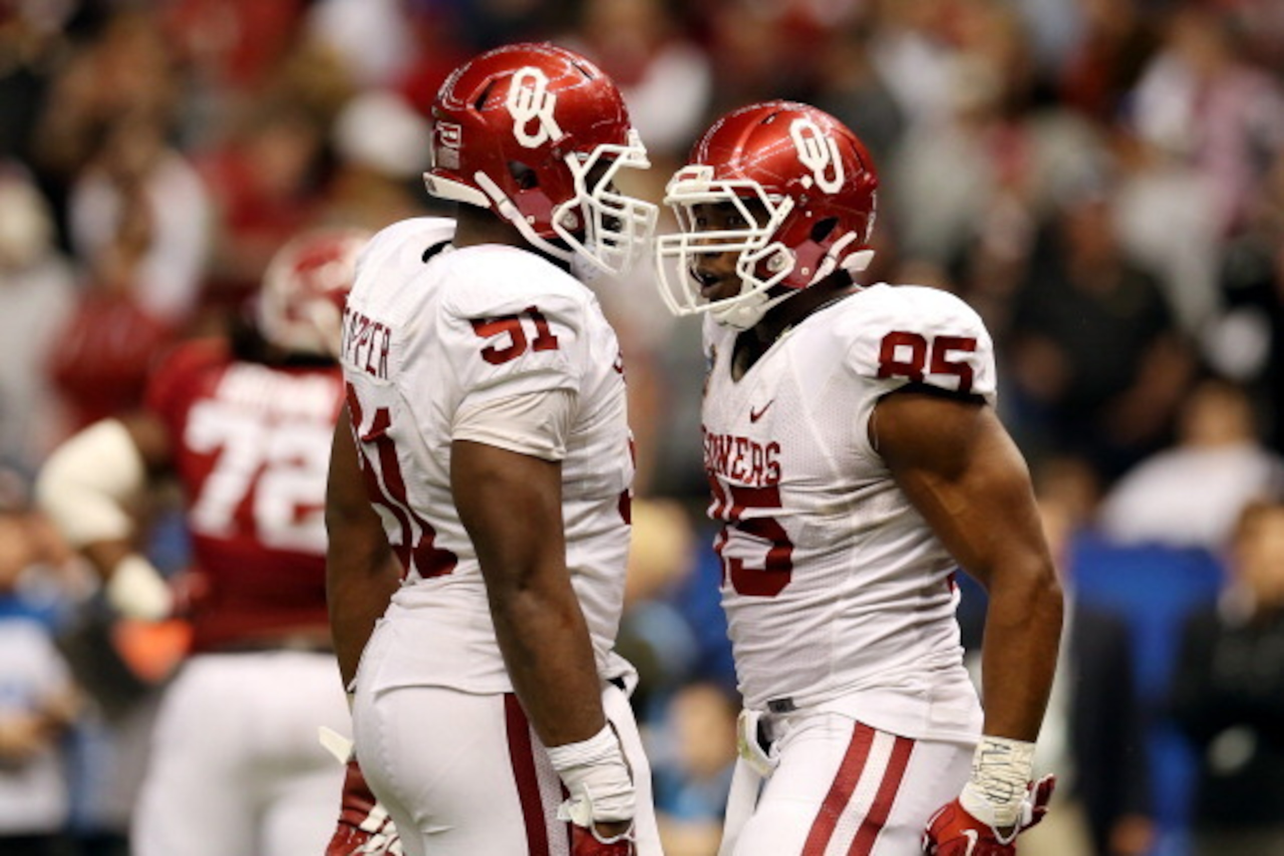 NEW ORLEANS, LA - JANUARY 02: Geneo Grissom #85 of the Oklahoma Sooners celebrates after scoring a touchdown with Charles Tapper #91 after recovering a fumble in the fourth quarter against the Alabama Crimson Tide during the Allstate Sugar Bowl at the Me NEW ORLEANS, LA - JANUARY 02: Geneo Grissom #85 of the Oklahoma Sooners celebrates after scoring a touchdown with Charles Tapper #91 after recovering a fumble in the fourth quarter against the Alabama Crimson Tide during the Allstate Sugar Bowl at the Me