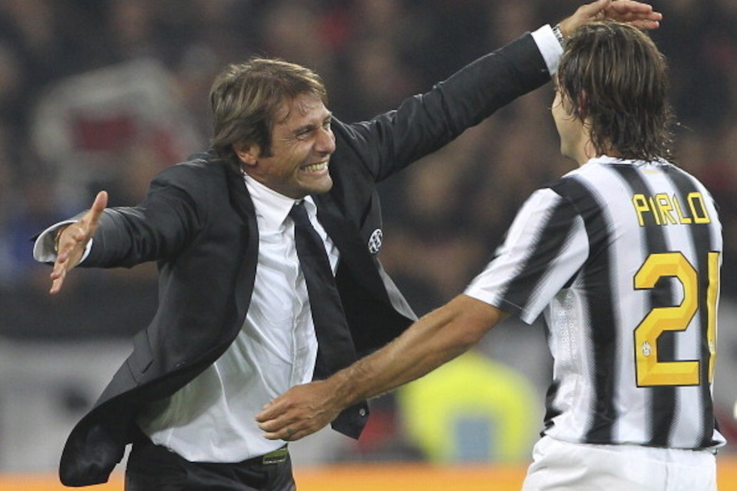TURIN, ITALY - OCTOBER 02:  Juventus FC manager Antonio Conte celebrates the victory with Andrea Pirlo at the end of the Serie A match between Juventus FC and AC Milan on October 2, 2011 in Turin, Italy.  (Photo by Marco Luzzani/Getty Images)
