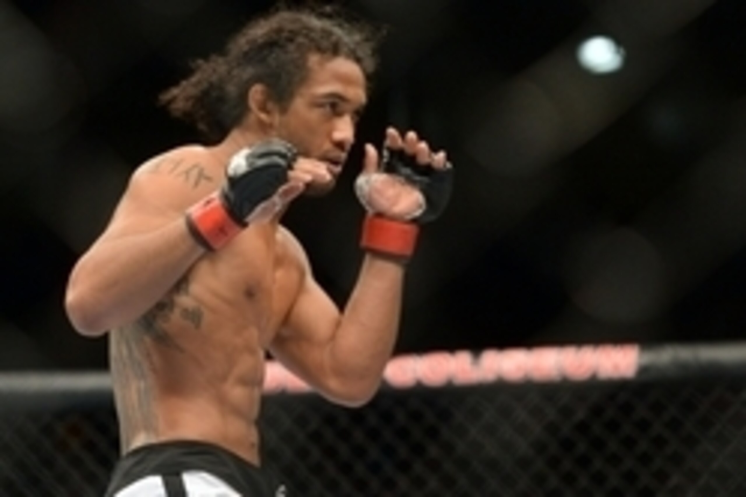 Jun 7, 2014; Albuquerque, NM, USA; Benson Henderson (red) and Rustam Khabilov (blue) fight during their lightweight bout during UFC Fight Night 42 at Tingley Coliseum. Henderson won via fourth round submission. Mandatory Credit: Joe Camporeale-USA TODAY S