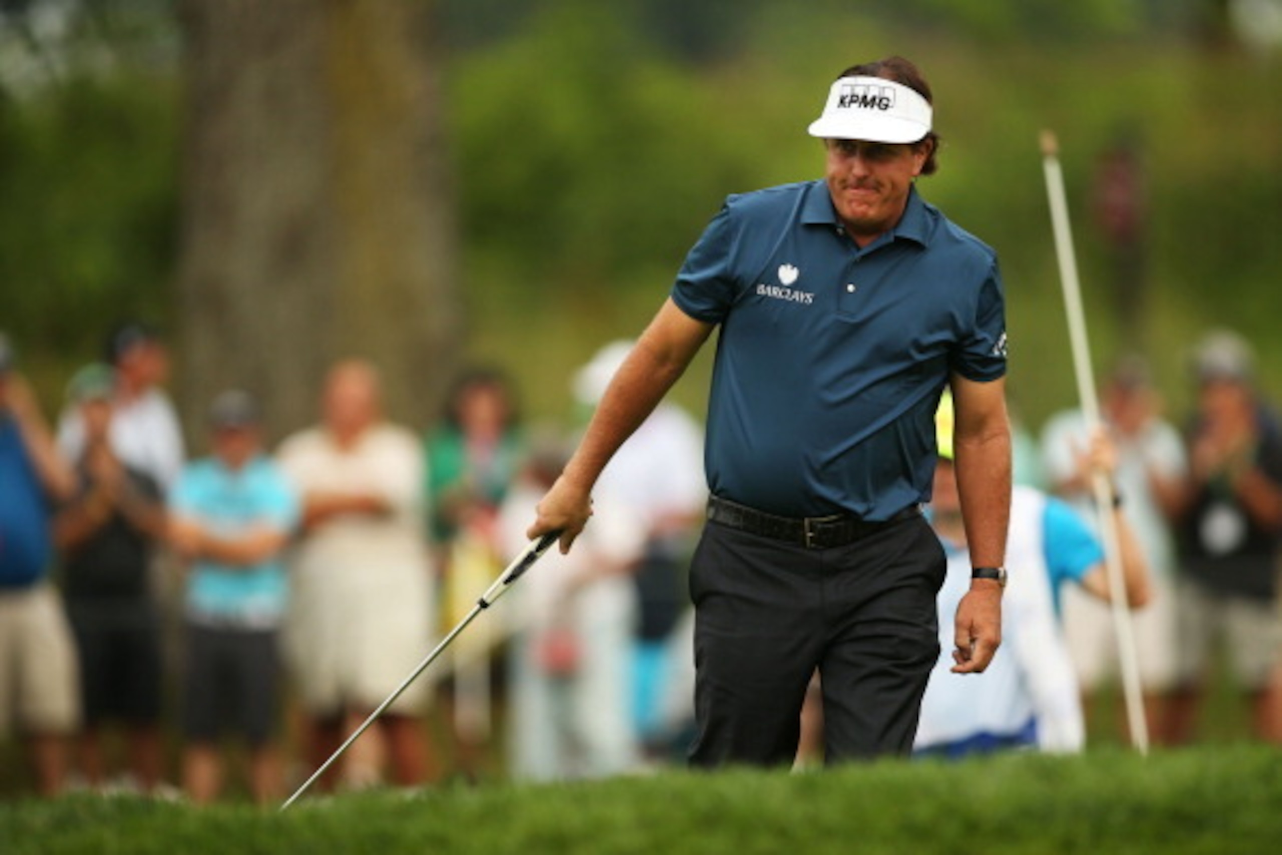PARAMUS, NJ - AUGUST 21:  Phil Mickelson reacts after putting for birdie on the second green during the first round of The Barclays at The Ridgewood Country Club on August 21, 2014 in Paramus, New Jersey.  (Photo by Darren Carroll/Getty Images)
