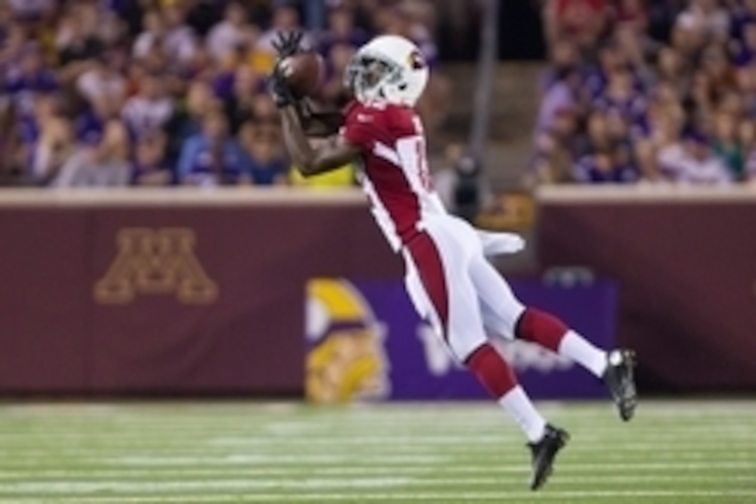 Aug 16, 2014; Minneapolis, MN, USA; Arizona Cardinals wide receiver John Brown (12) catches a pass in the second quarter against the Minnesota Vikings at TCF Bank Stadium. Mandatory Credit: Brad Rempel-USA TODAY Sports
